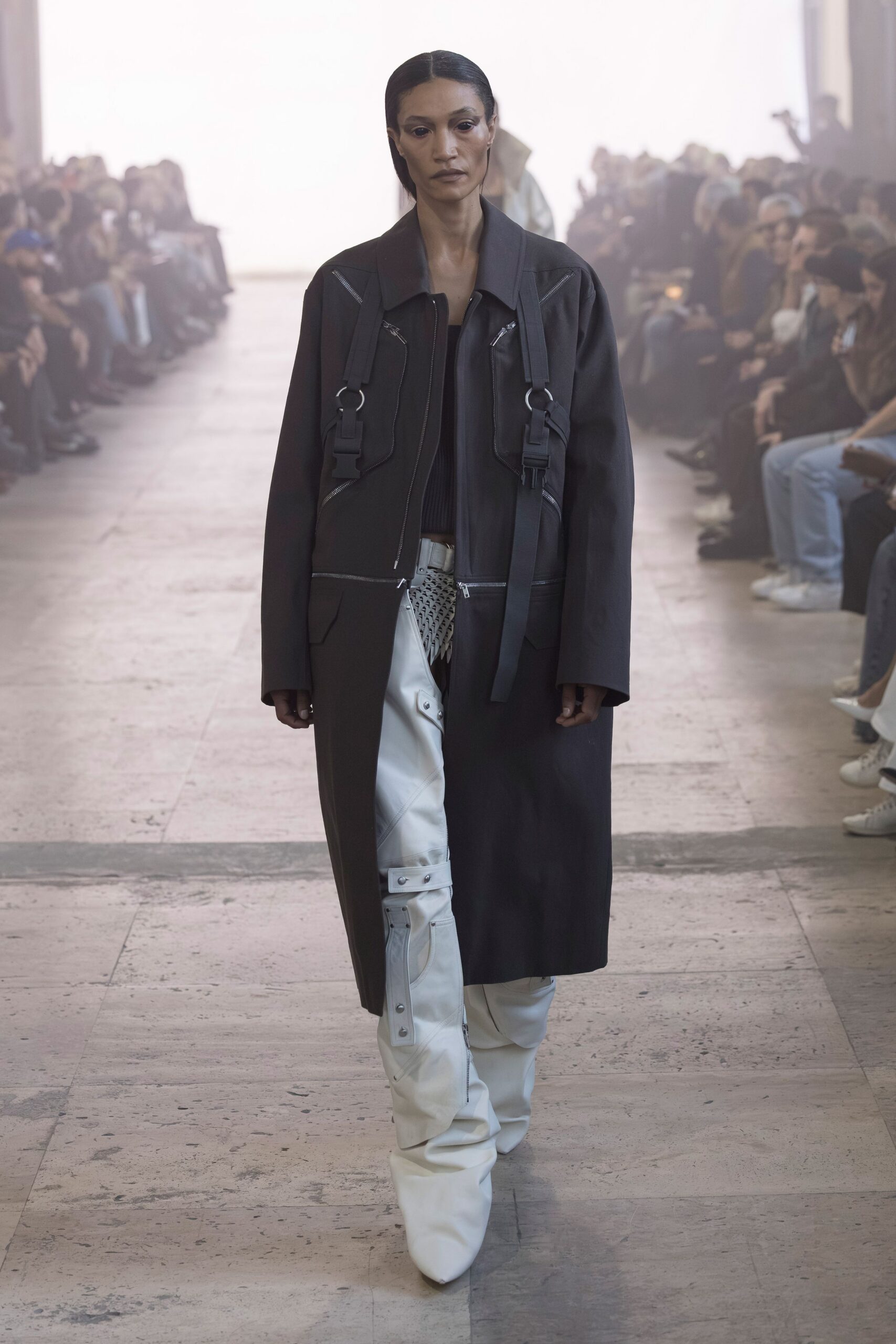 black coat and white cargo pants