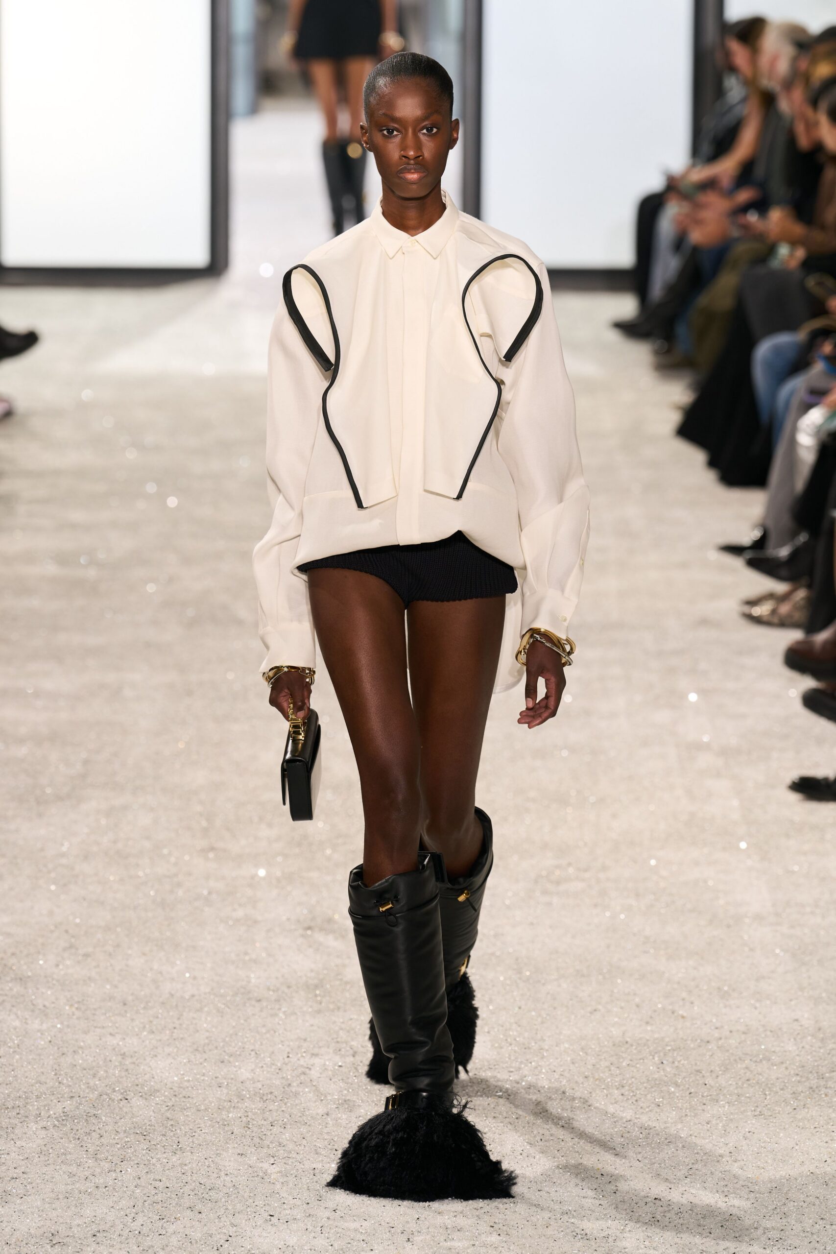 white fitted shirt with black shorts