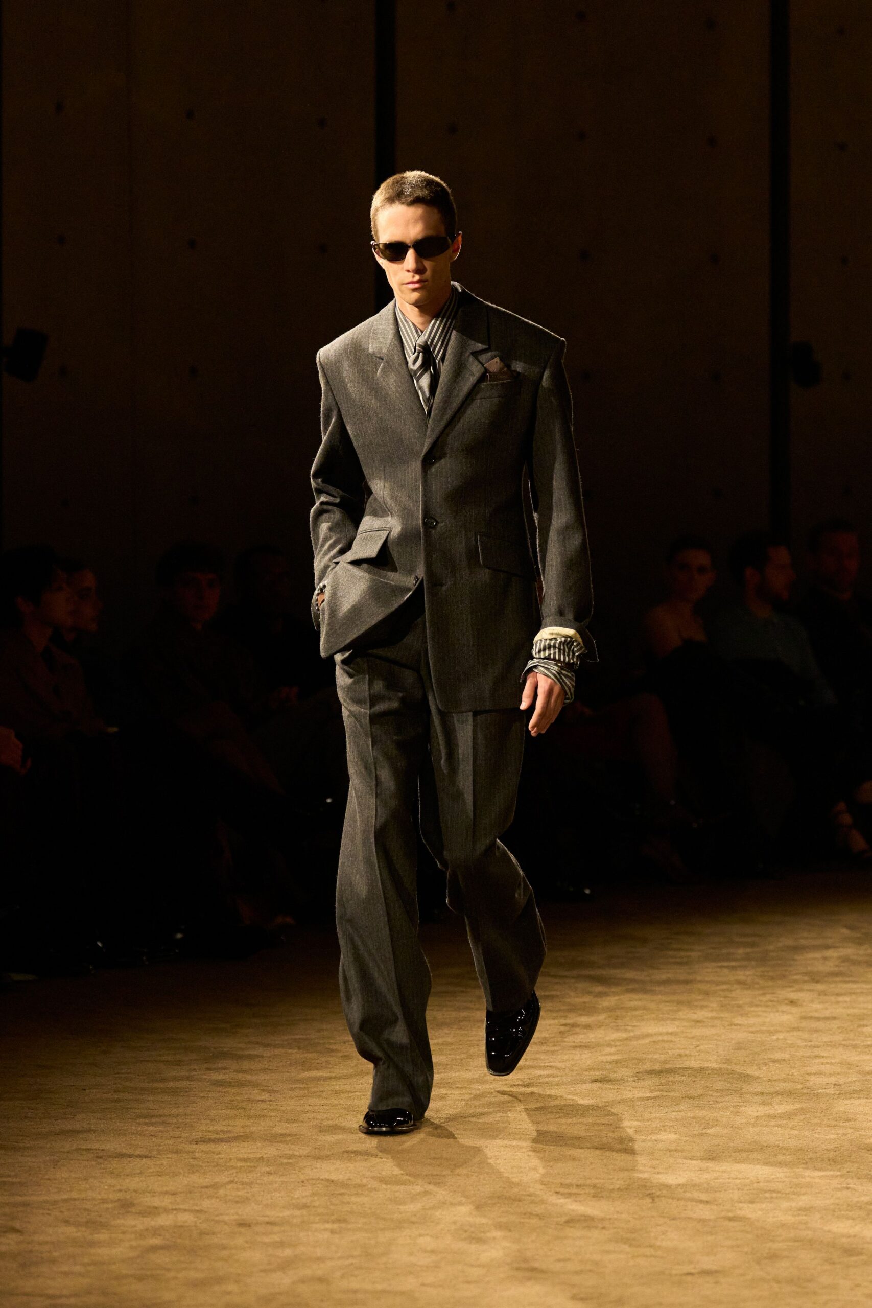 gray tailored suit with sunglasses