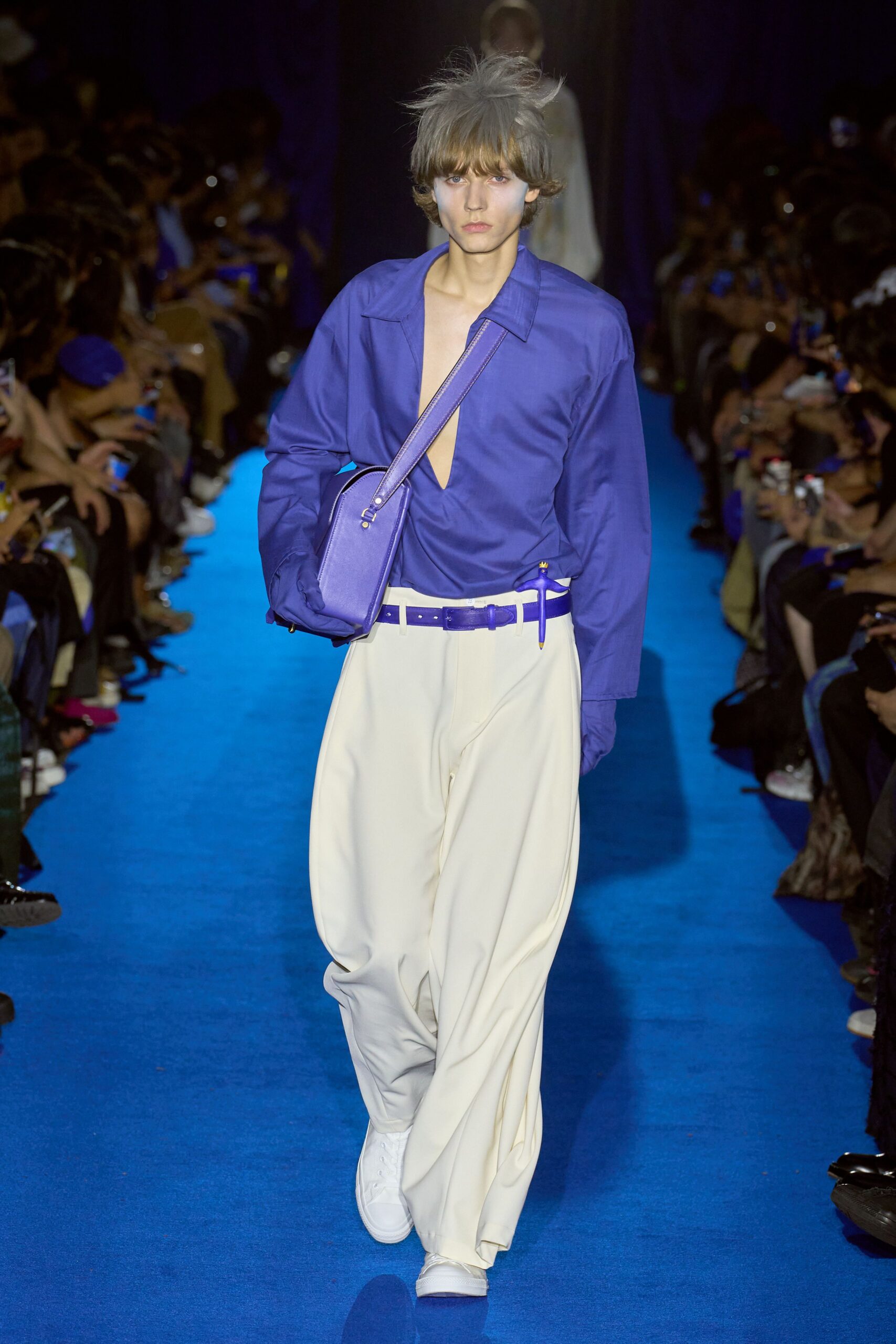 purple shirt white pants outfit