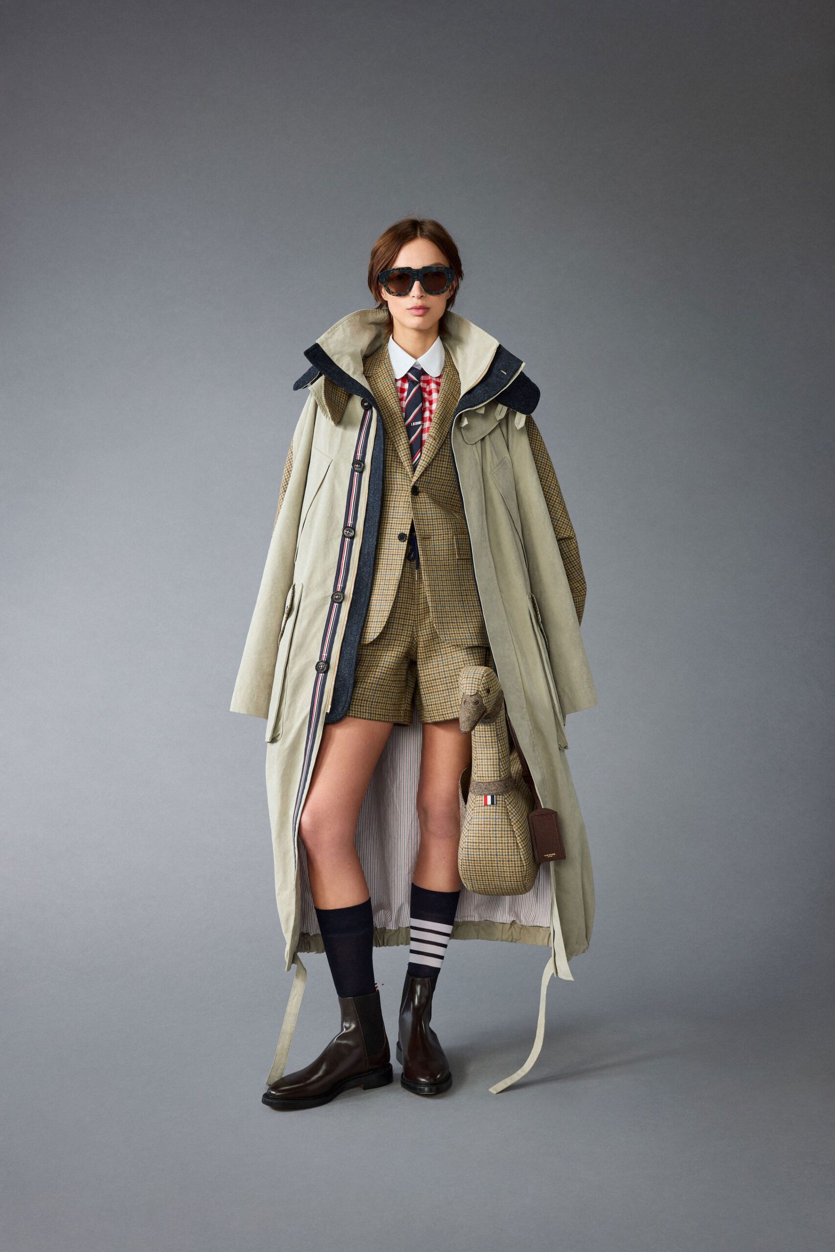 beige coat with brown suit and shorts