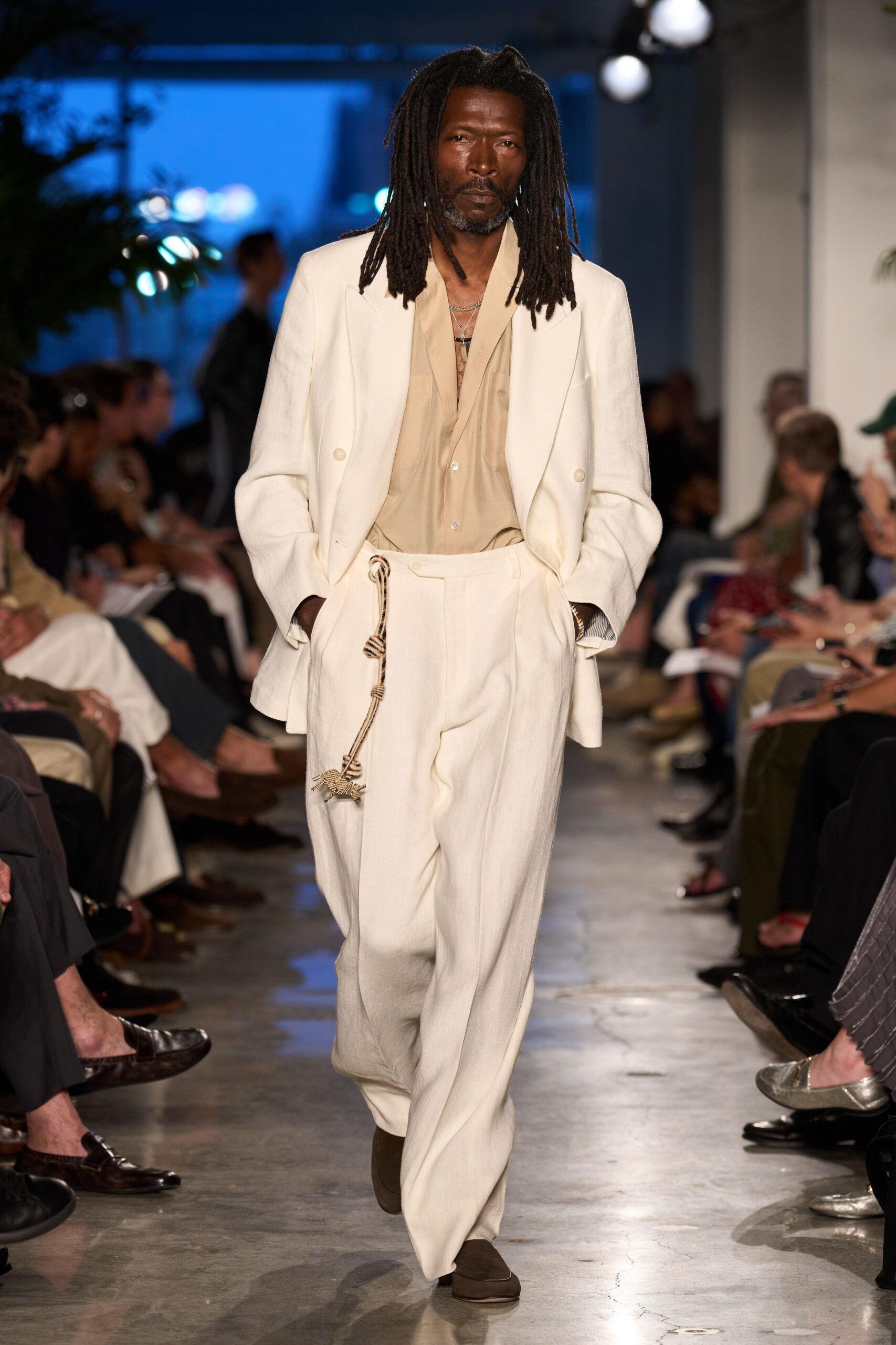 white tailored suit with beige shirt
