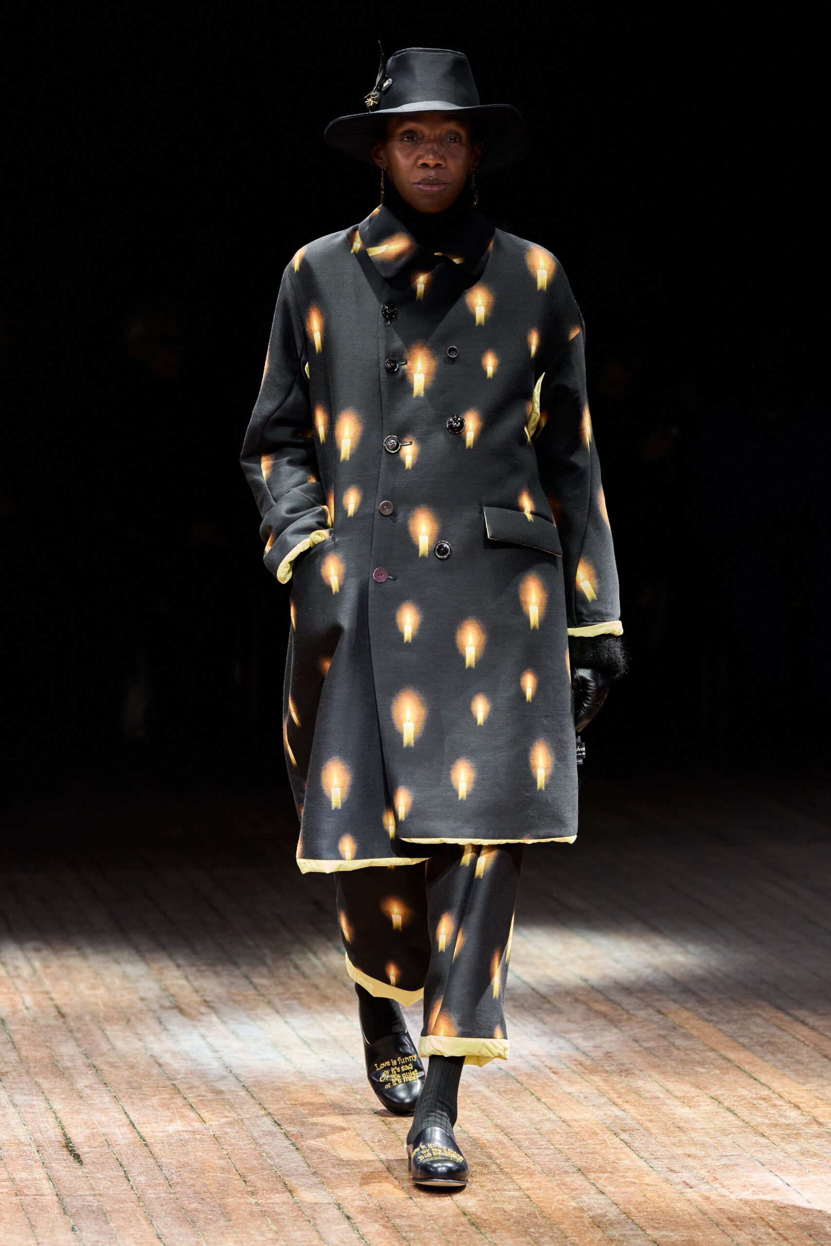 black wool long-sleeve collared relaxed buttoned printed coat