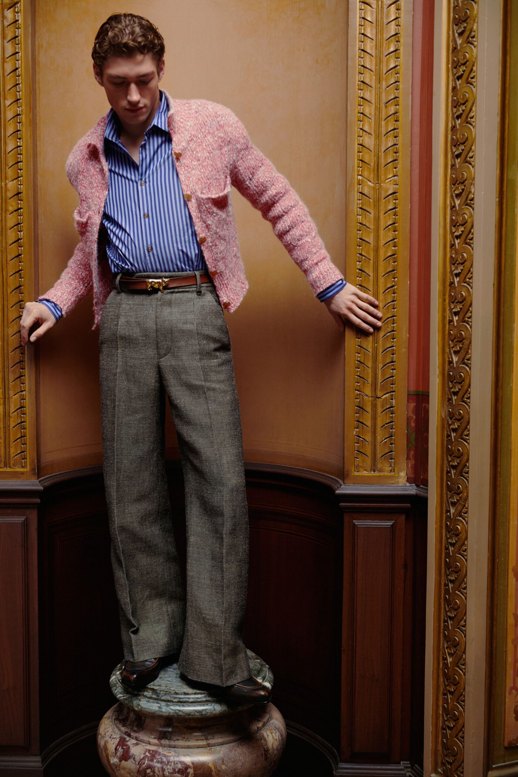 pink wool cardigan with striped shirt