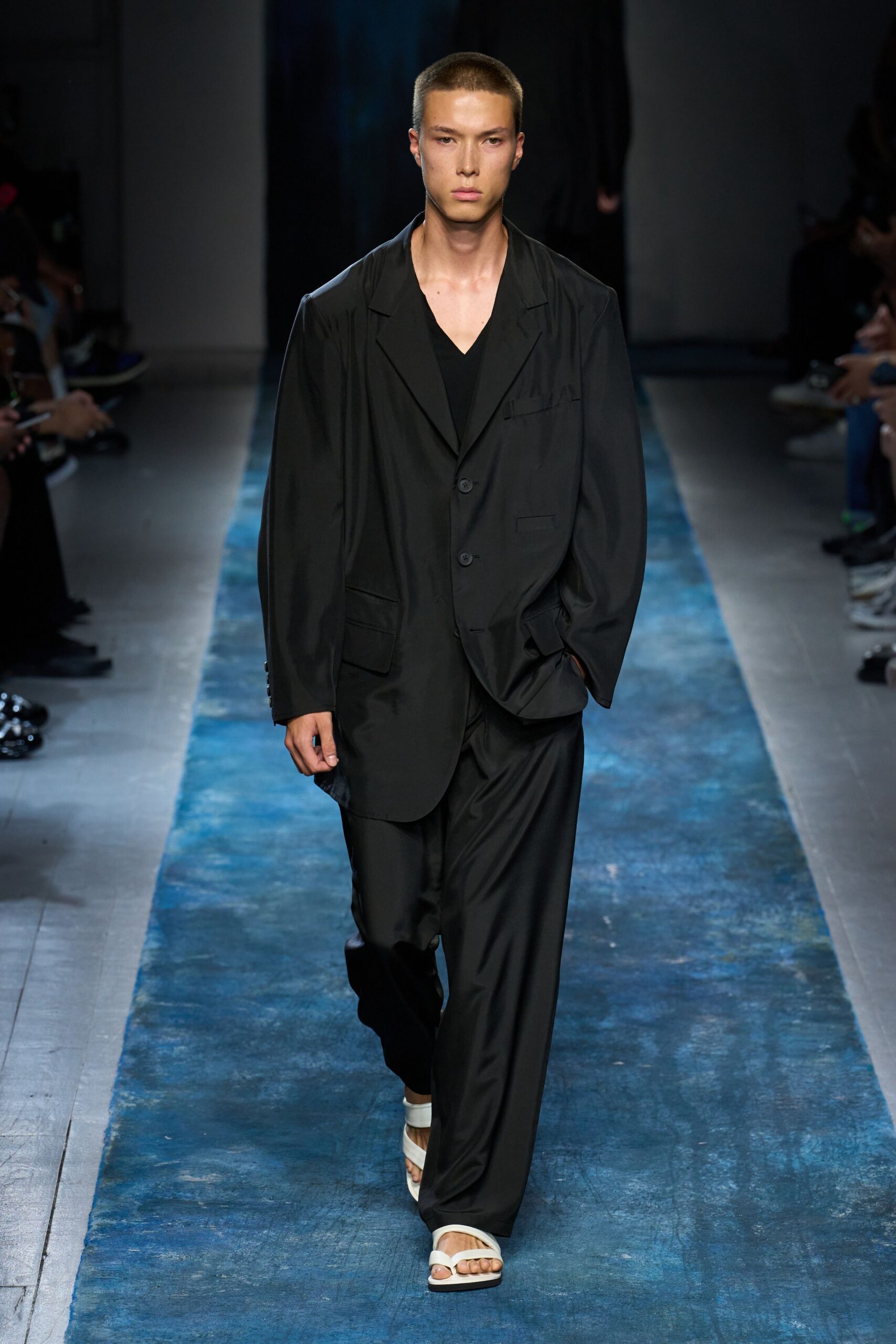 black relaxed suit with white shoes