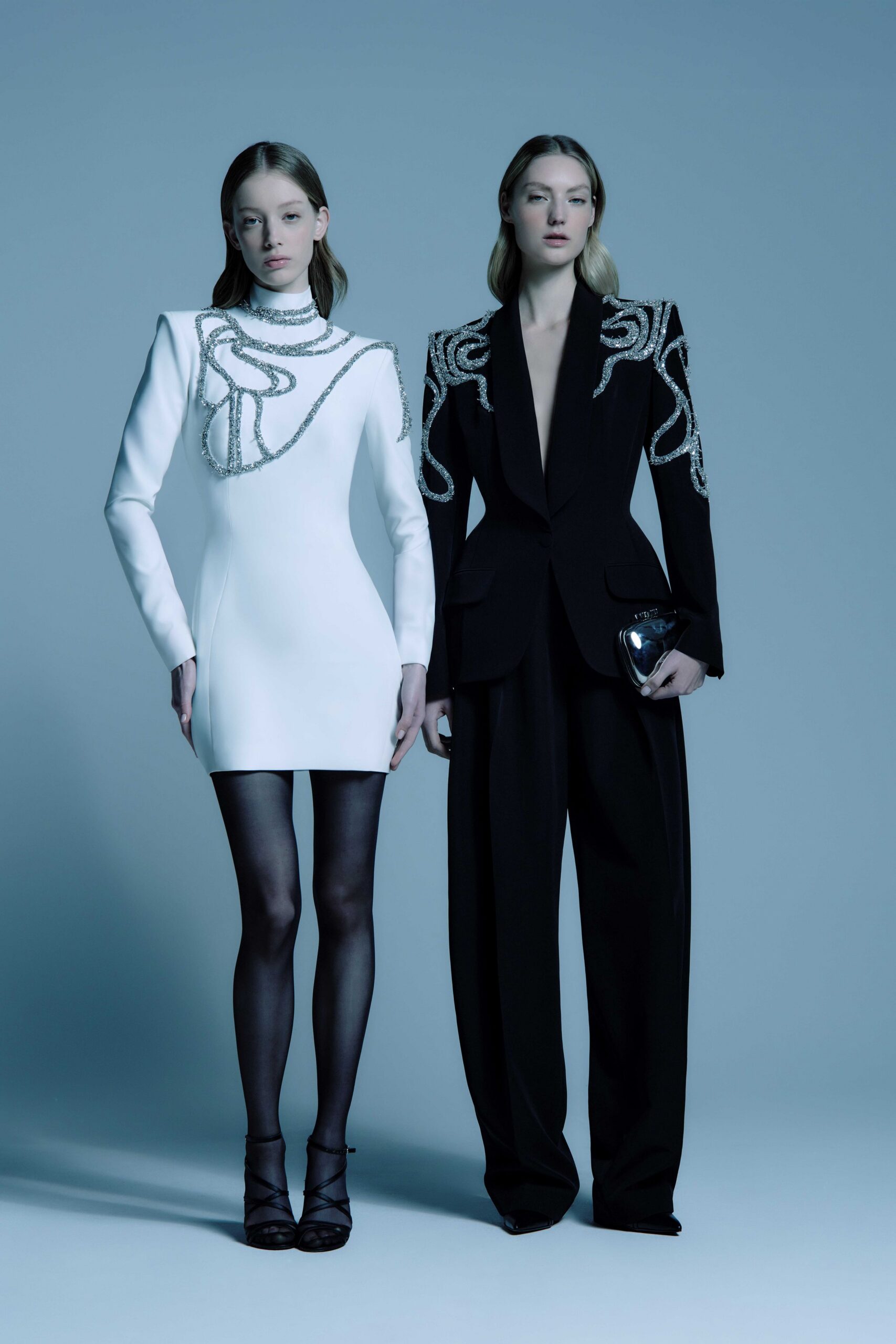 white mini-dress and black suit