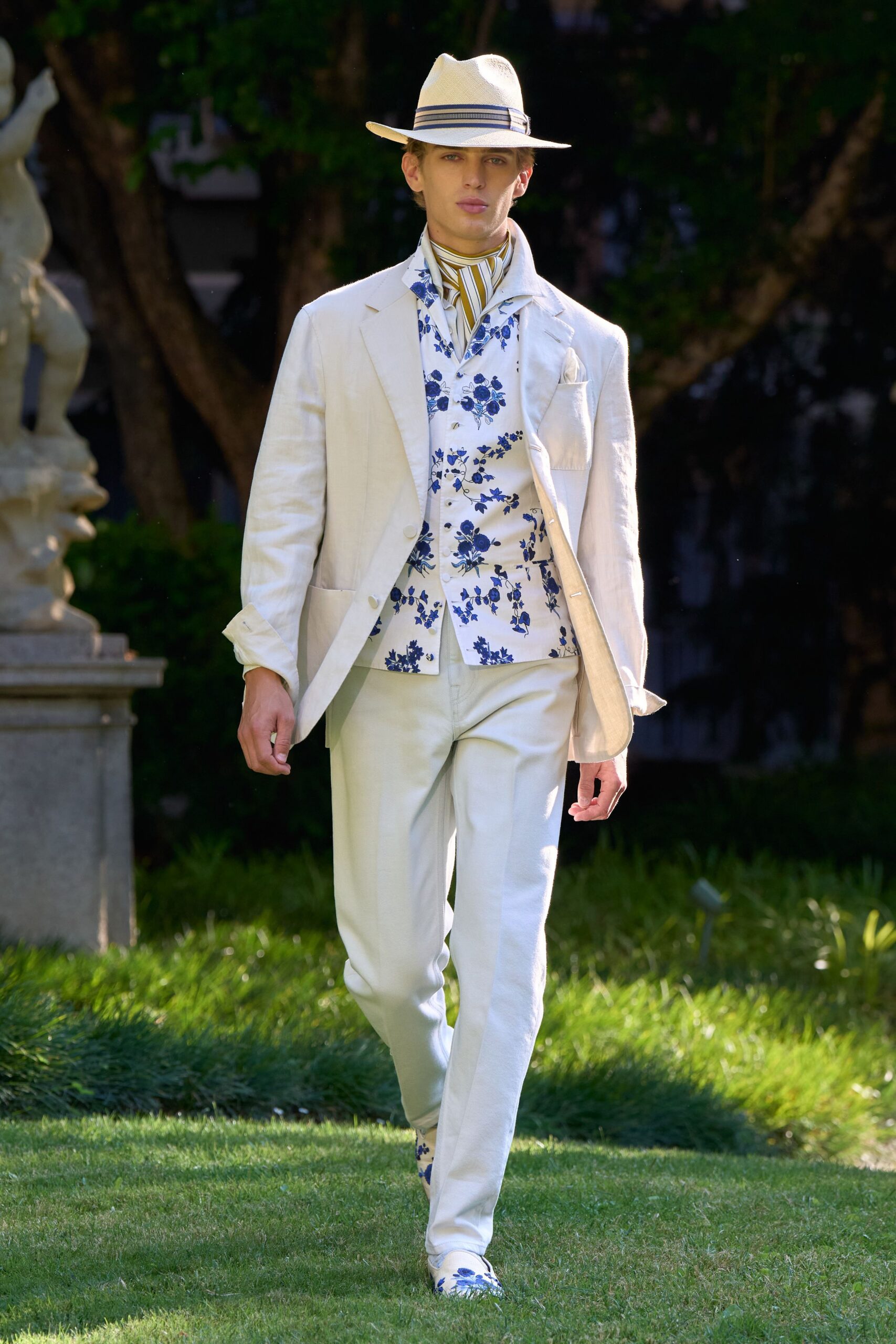 white tailored suit with floral shirt