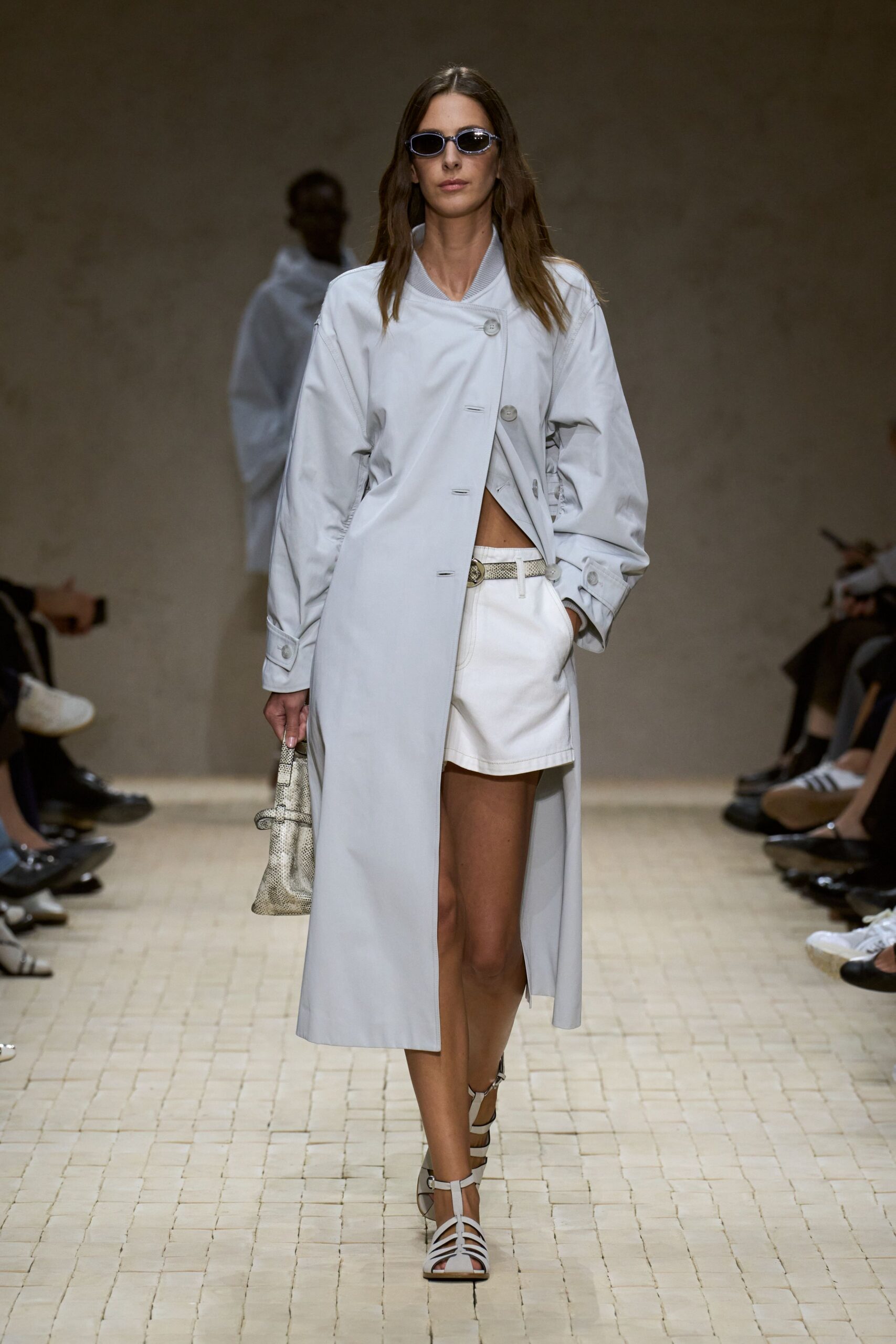 gray trench coat with white shorts