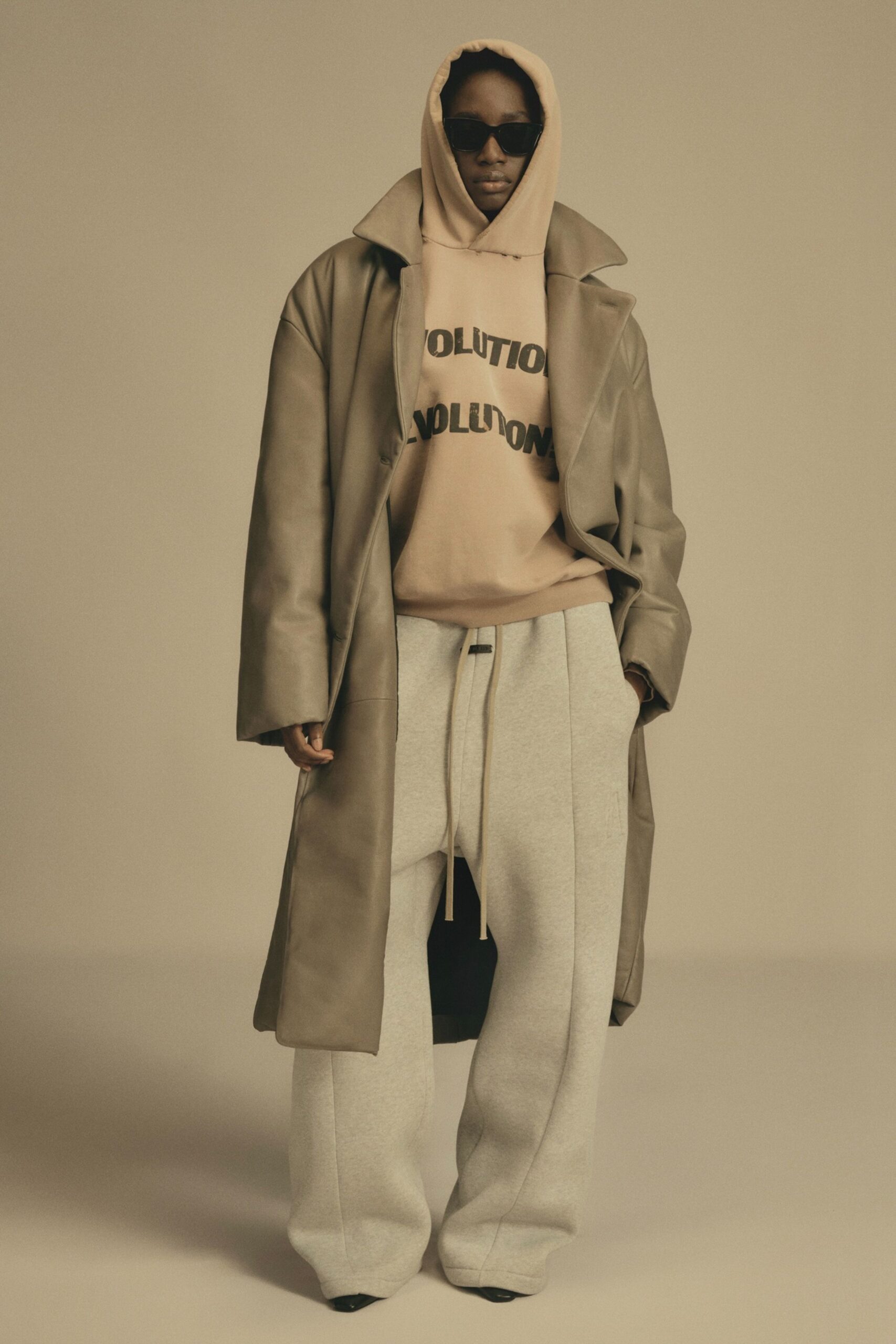 beige leather coat with pink hoodie
