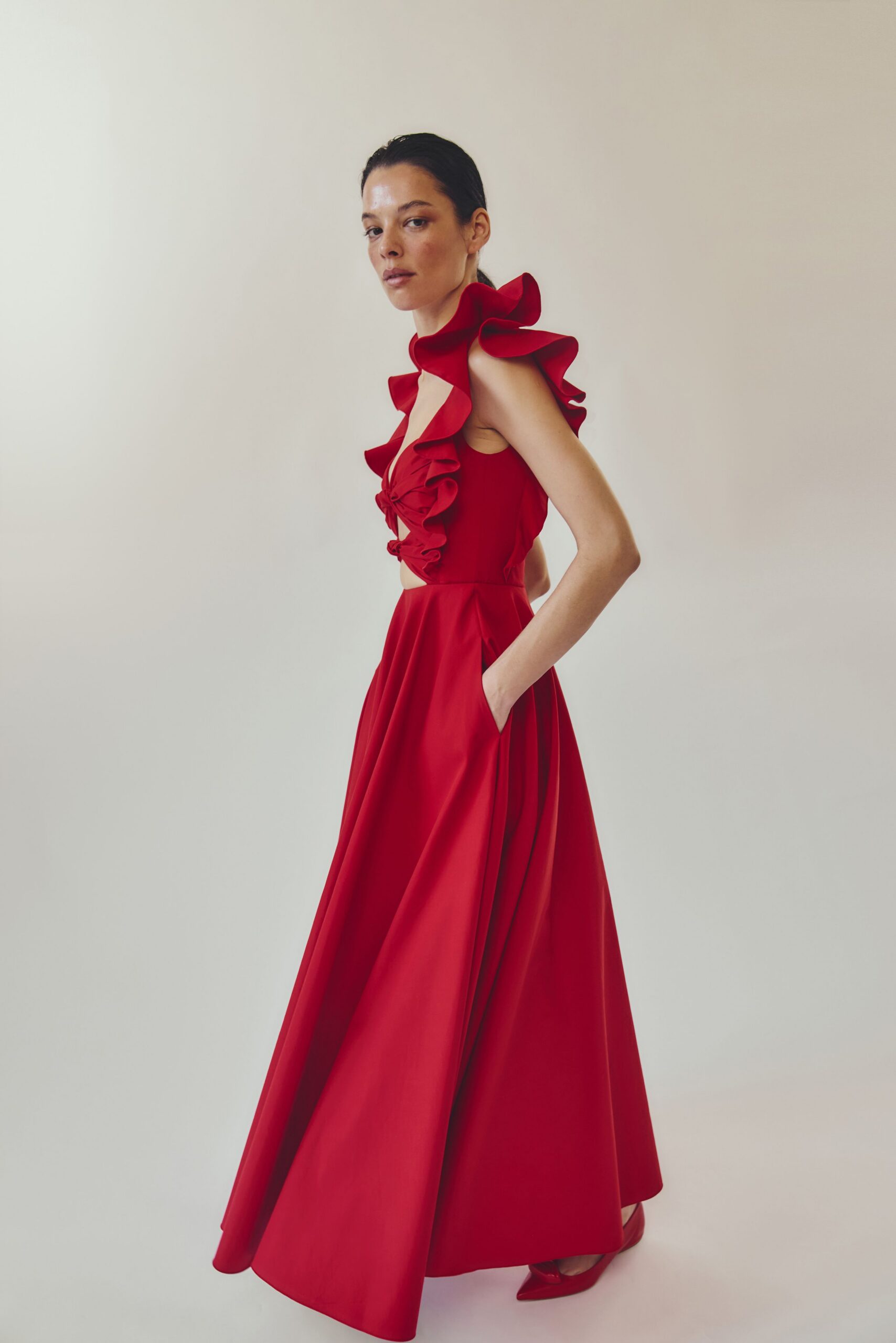 red cotton sleeveless high-neck fitted ruffled pleated gown