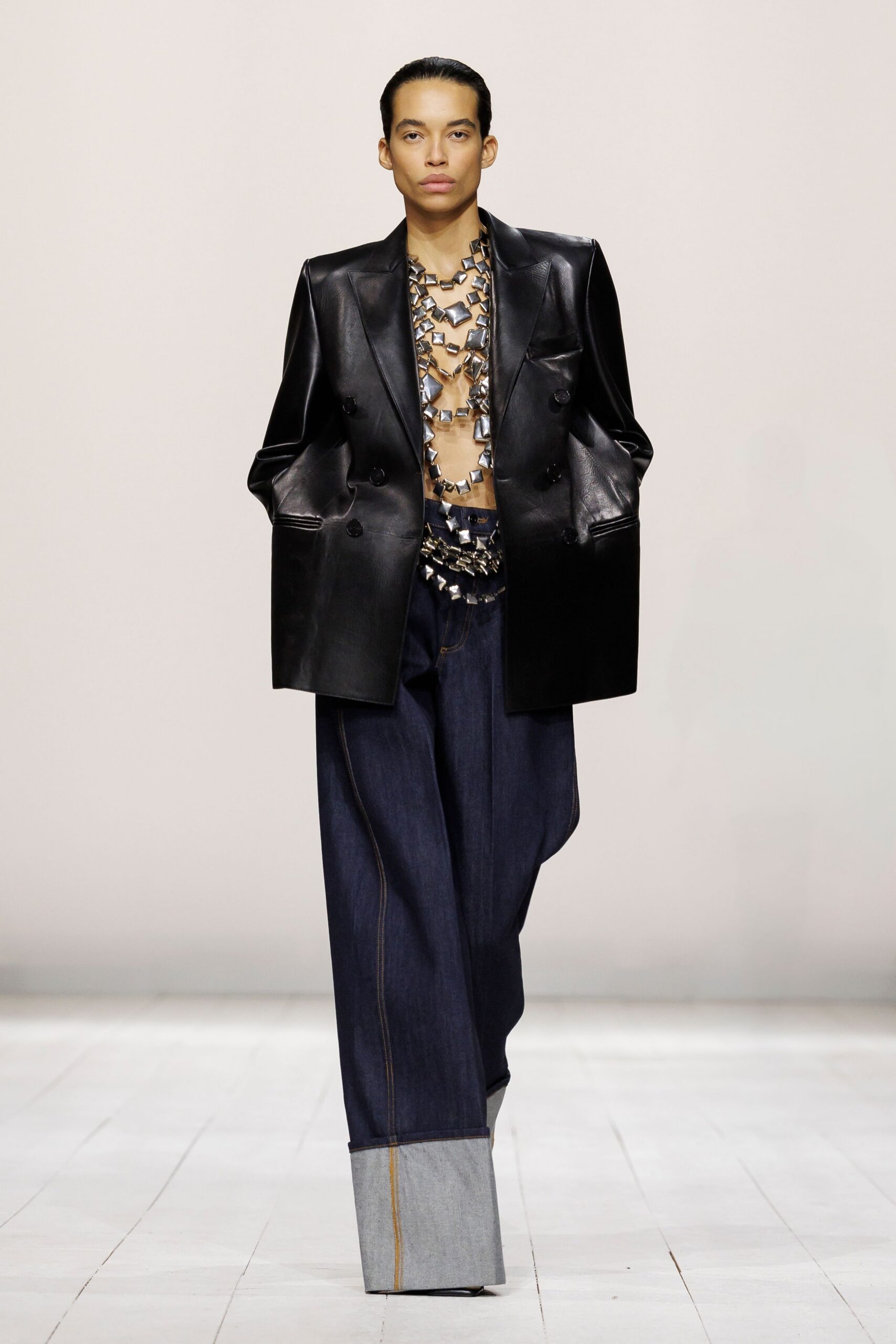 black leather blazer with denim pants