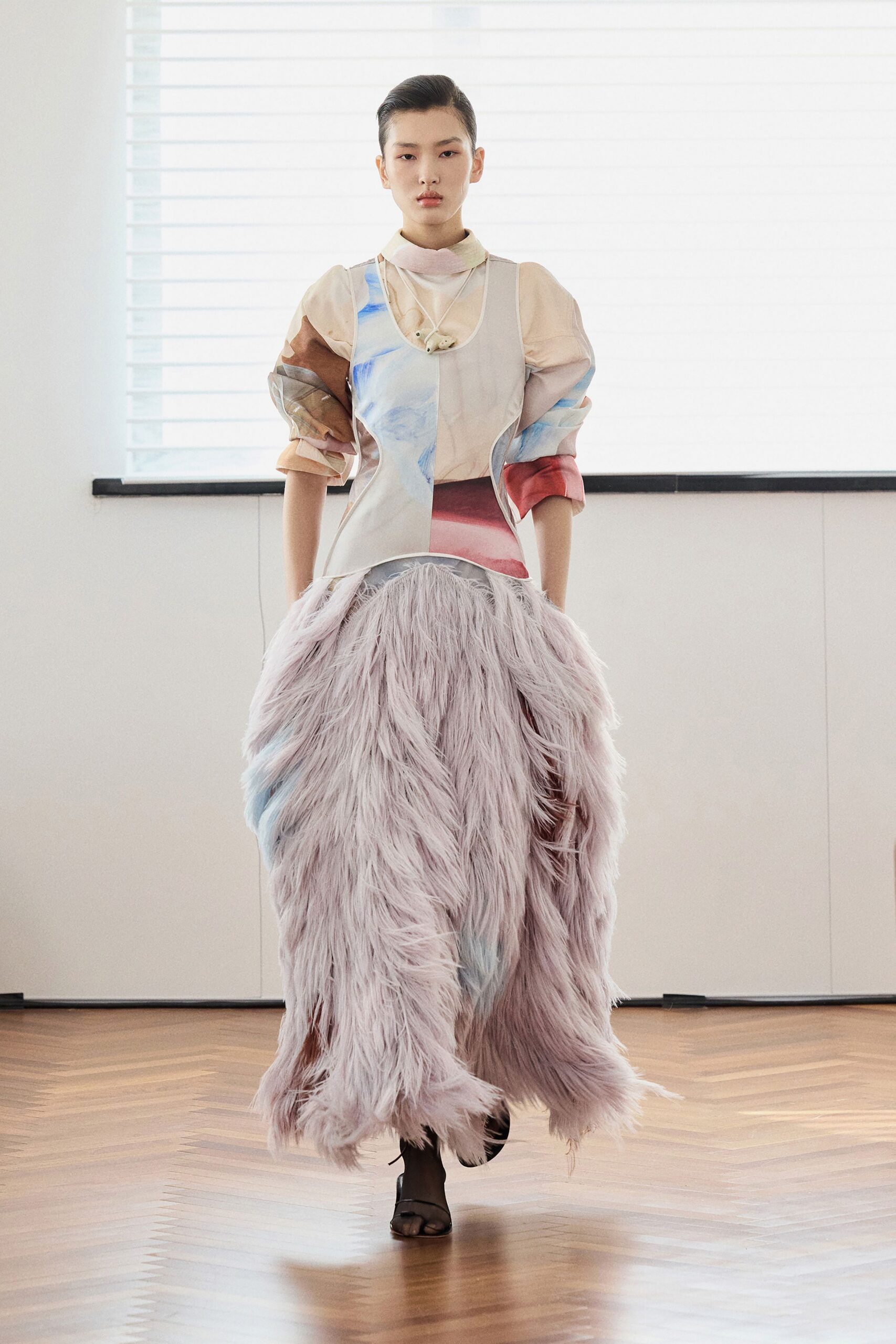 beige silk relaxed top with pink fur skirt