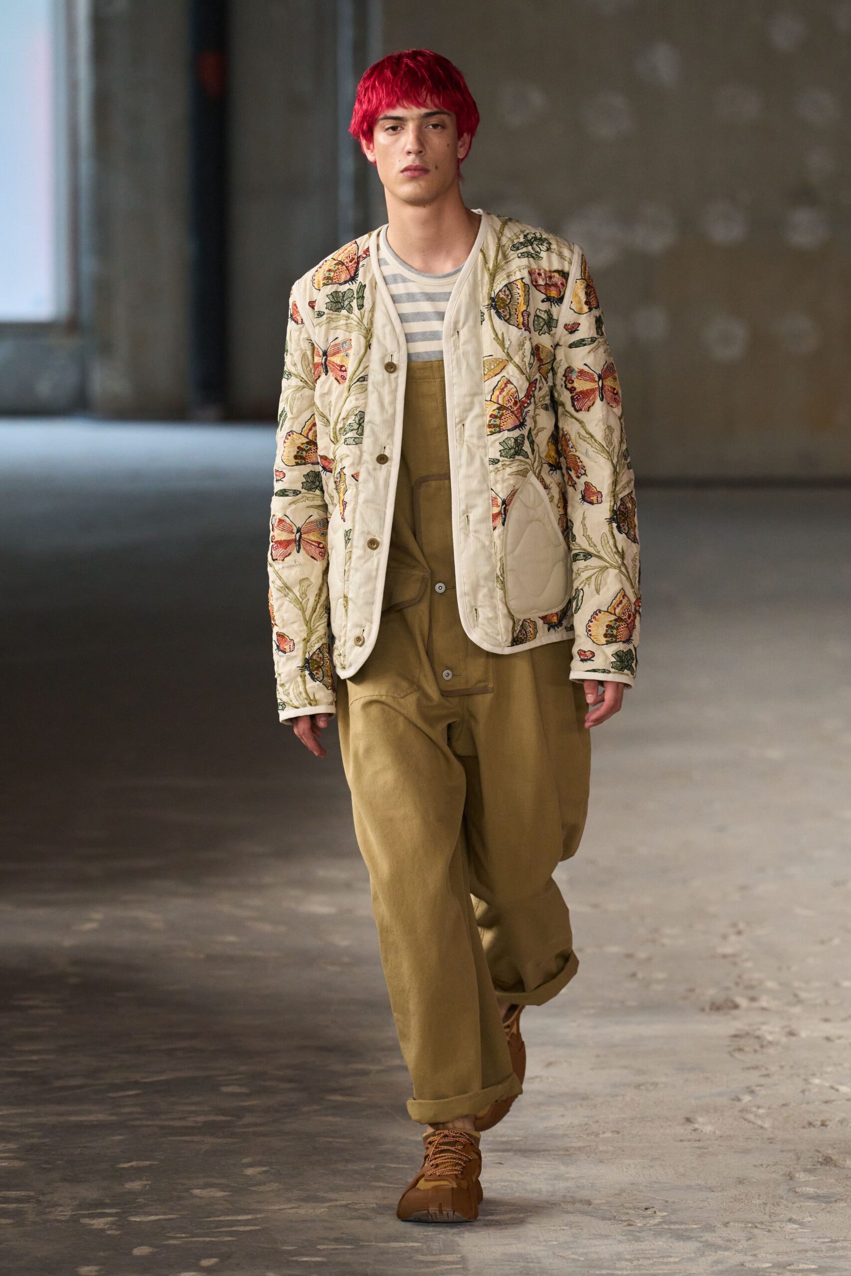 beige embroidered jacket and olive jumpsuit
