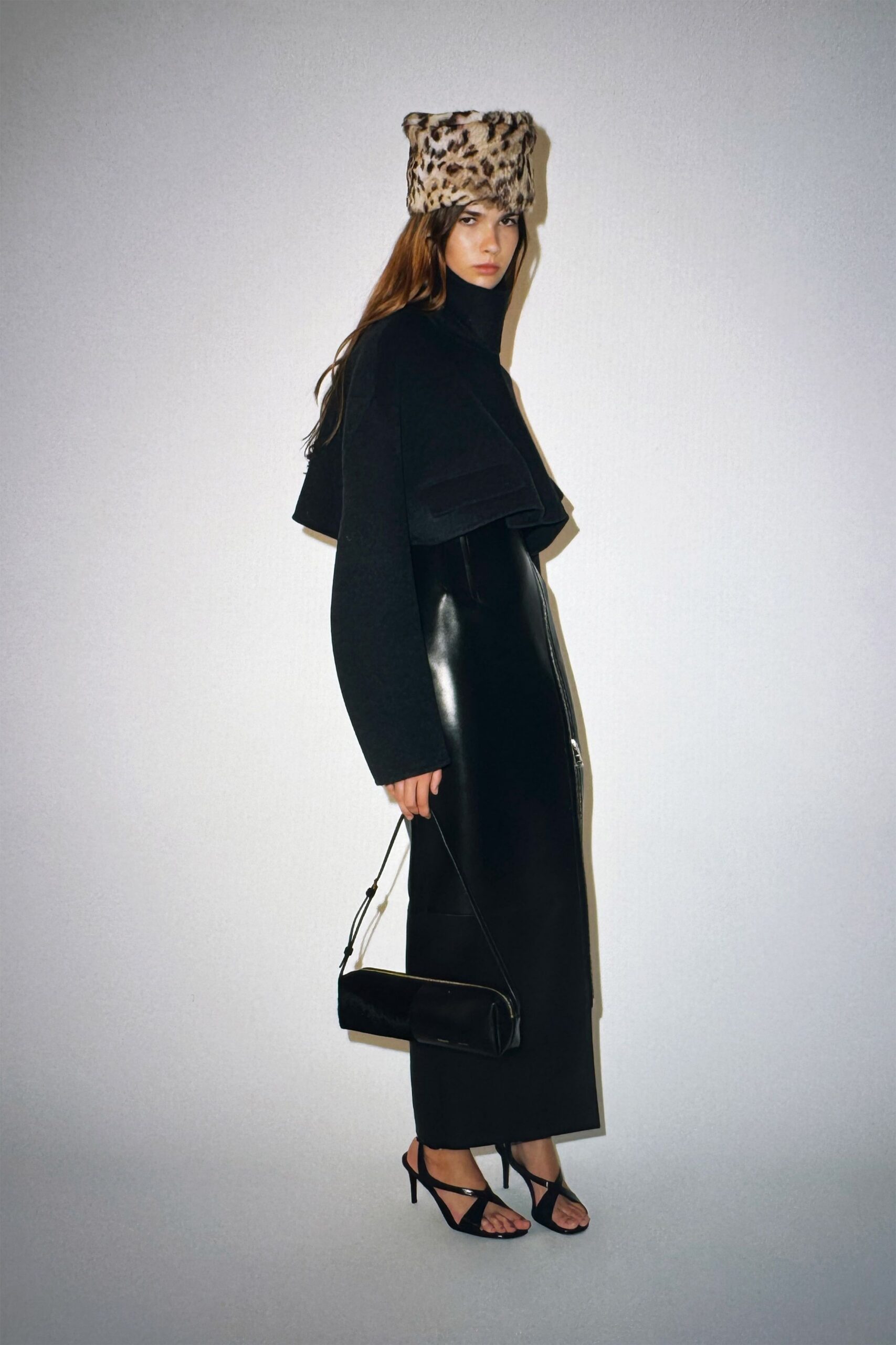 black wool coat and leather skirt