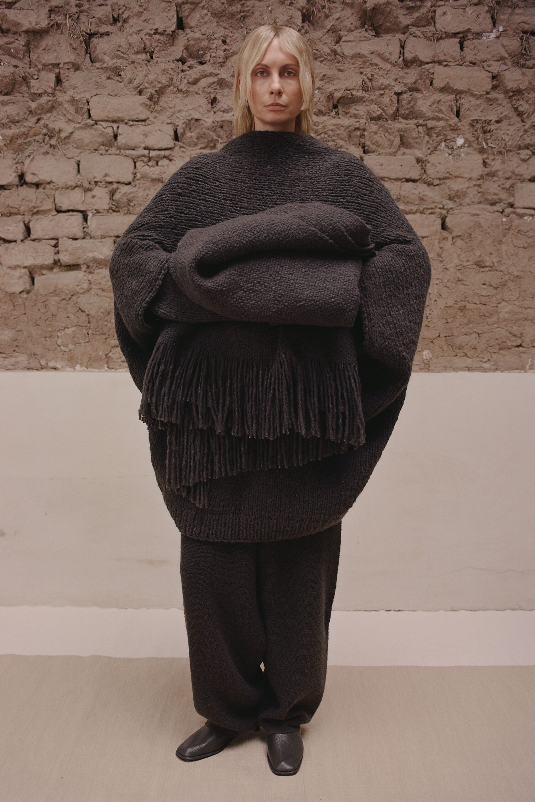 black wool long-sleeve high-neck oversized fringed top