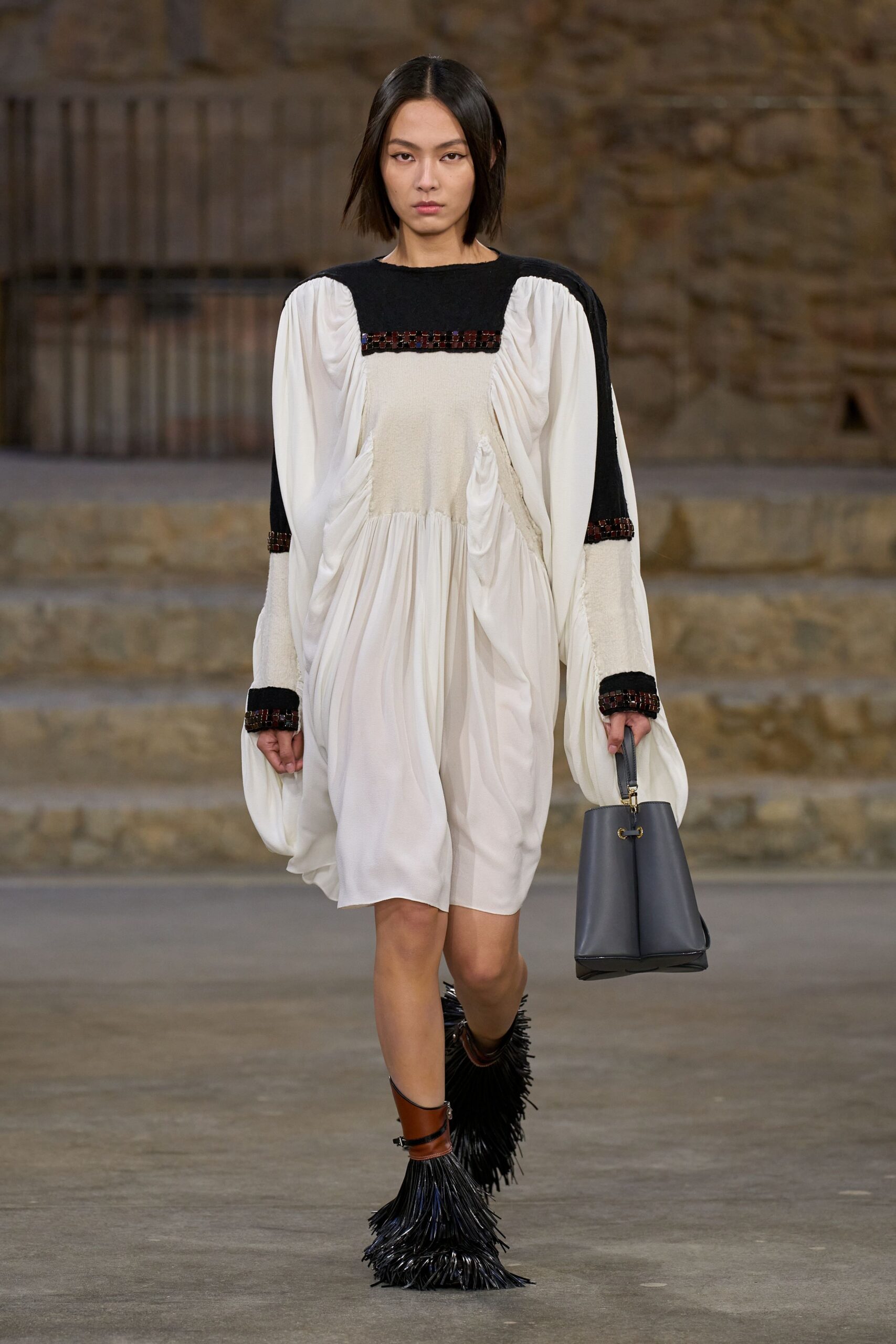 white relaxed midi dress with fringed boots