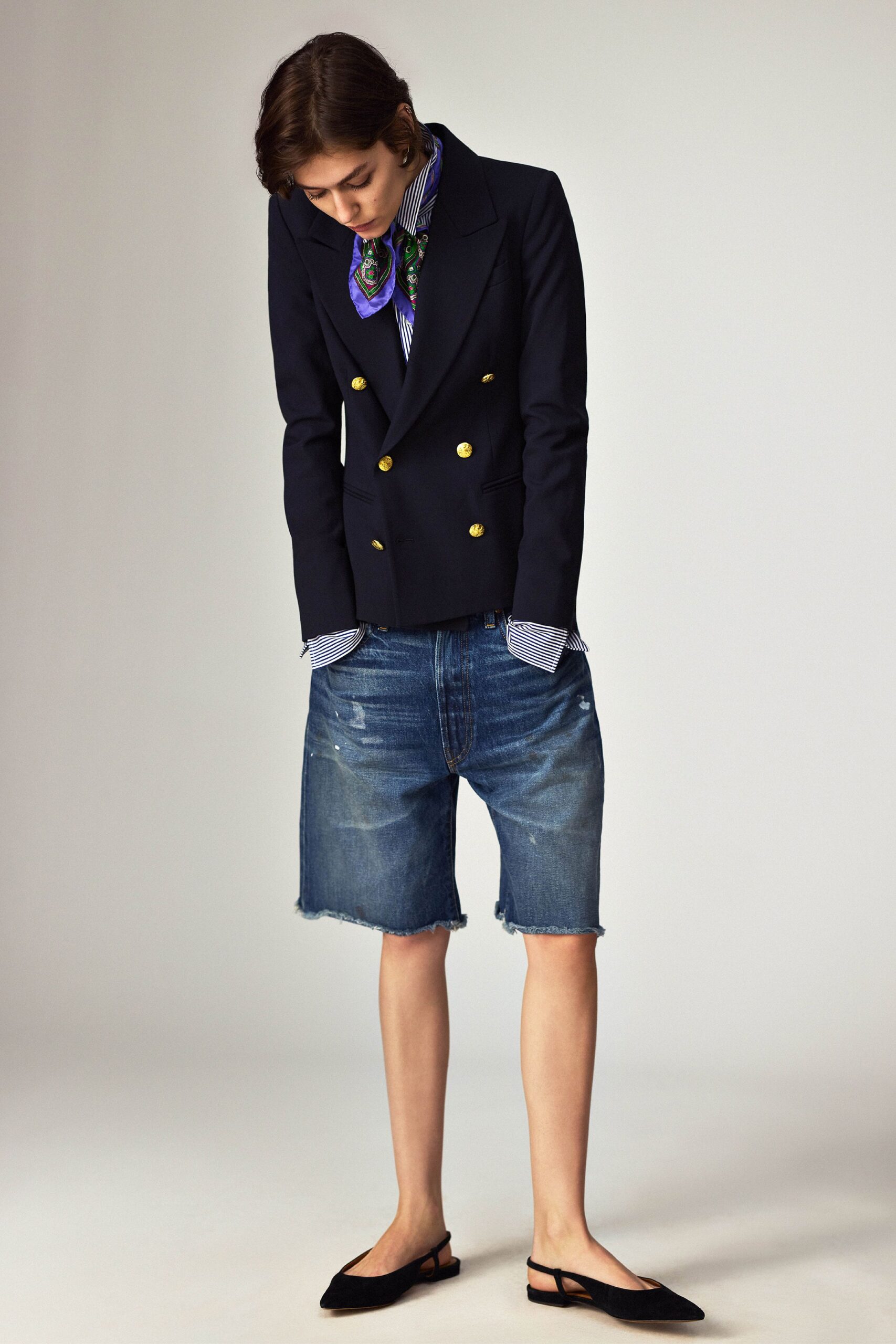 black tailored blazer with denim shorts