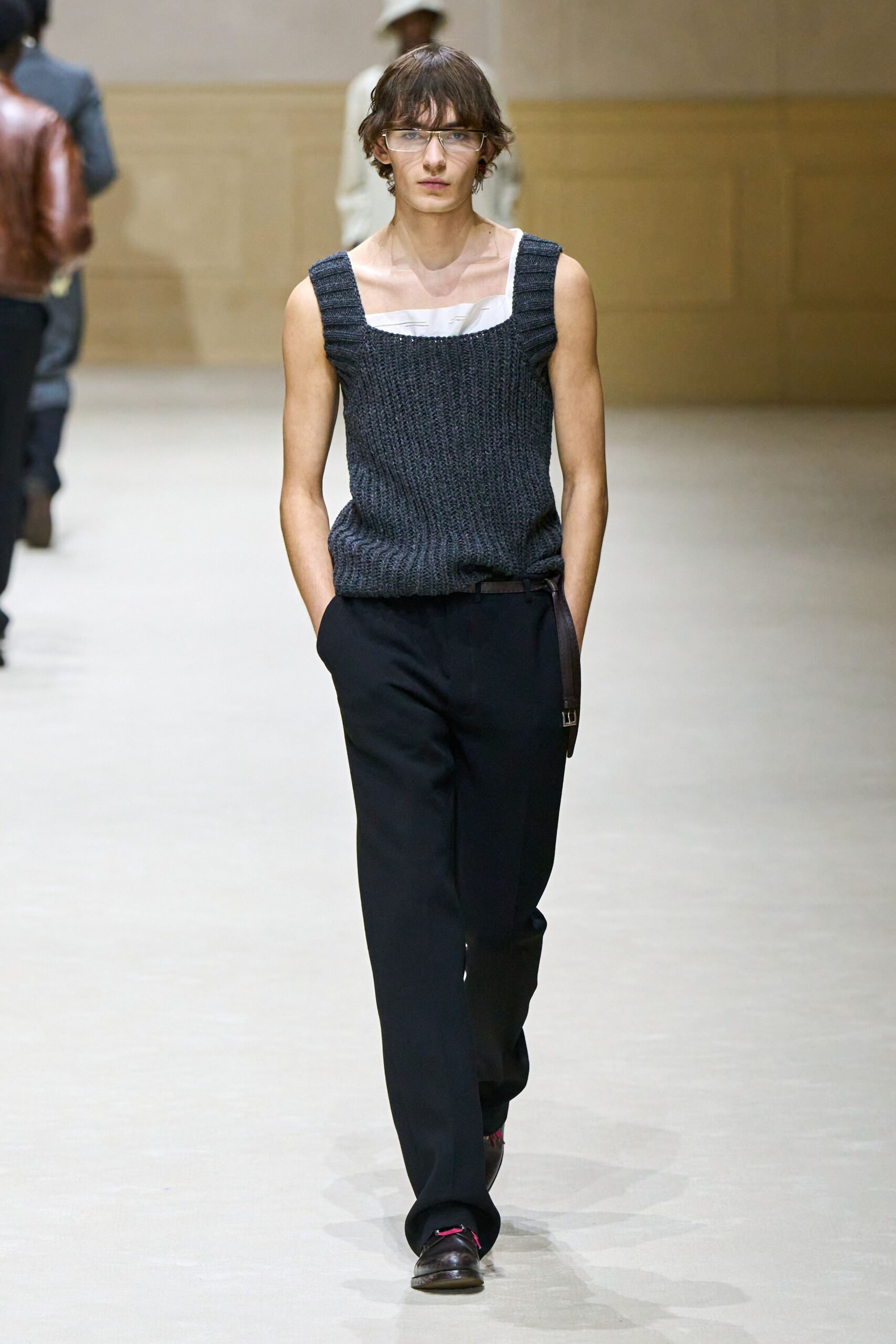 gray wool sleeveless top with black tailored pants