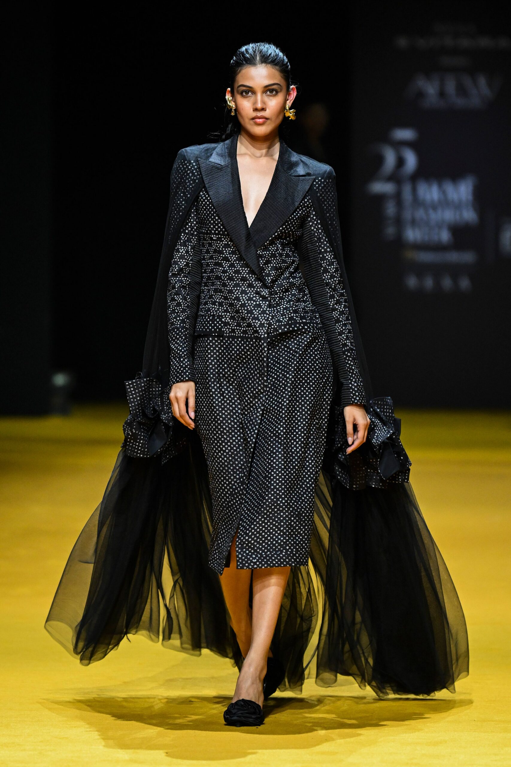 black embroidered blazer and skirt