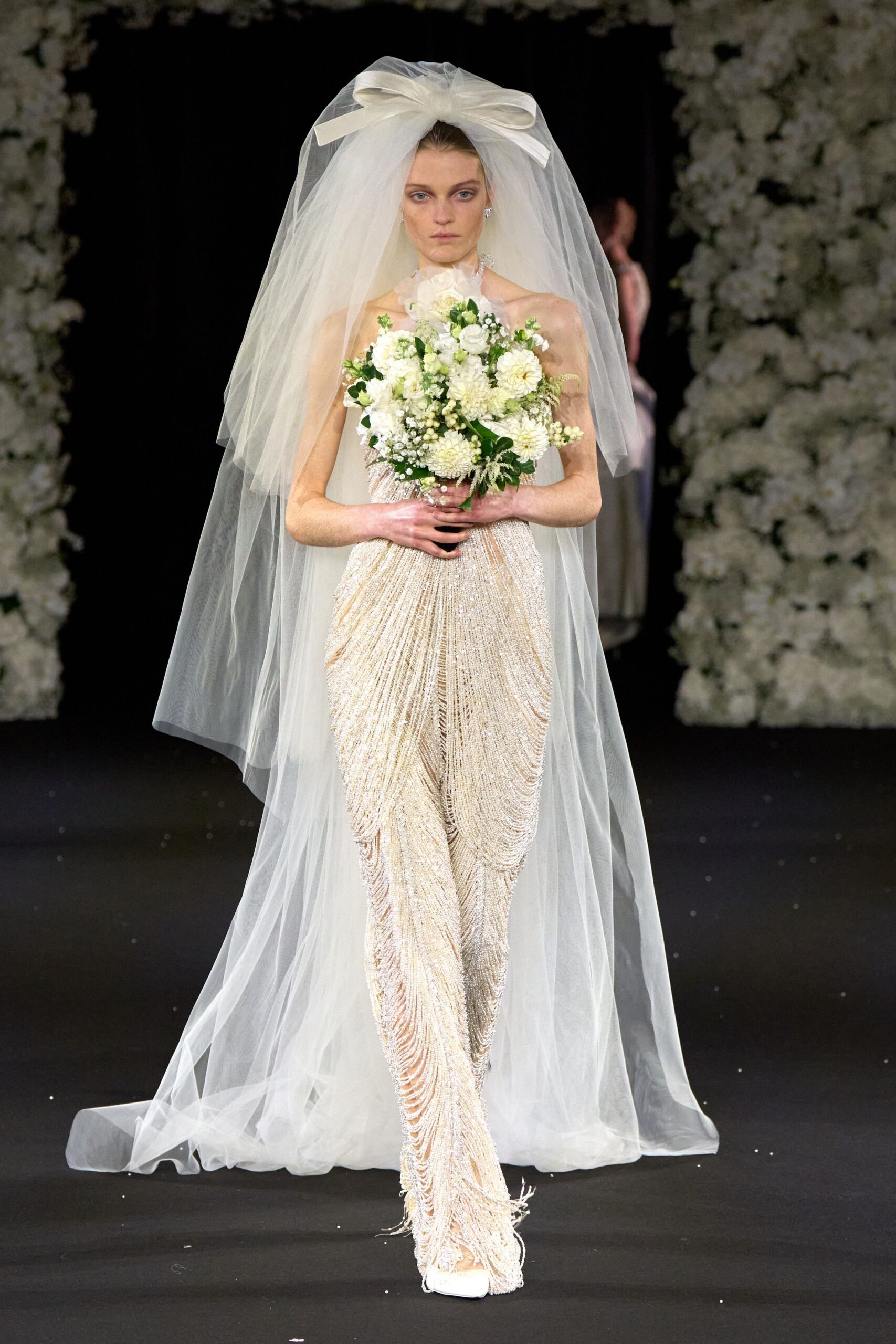 white fringed gown with veil