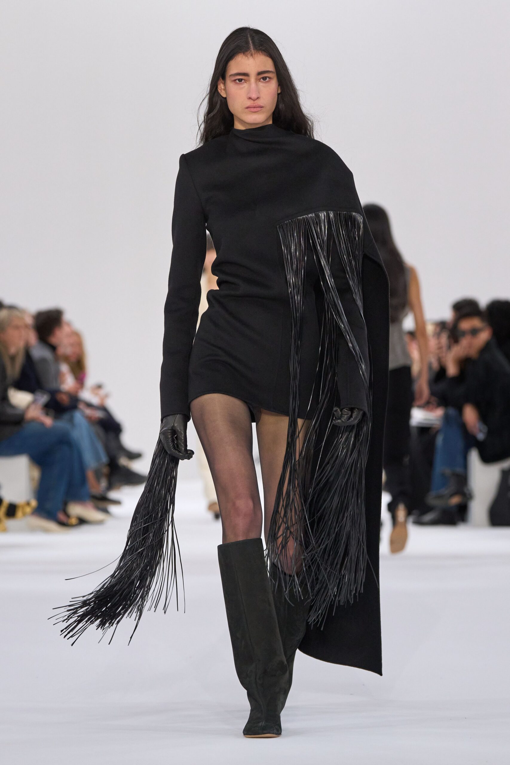 black fitted mini dress with fringes