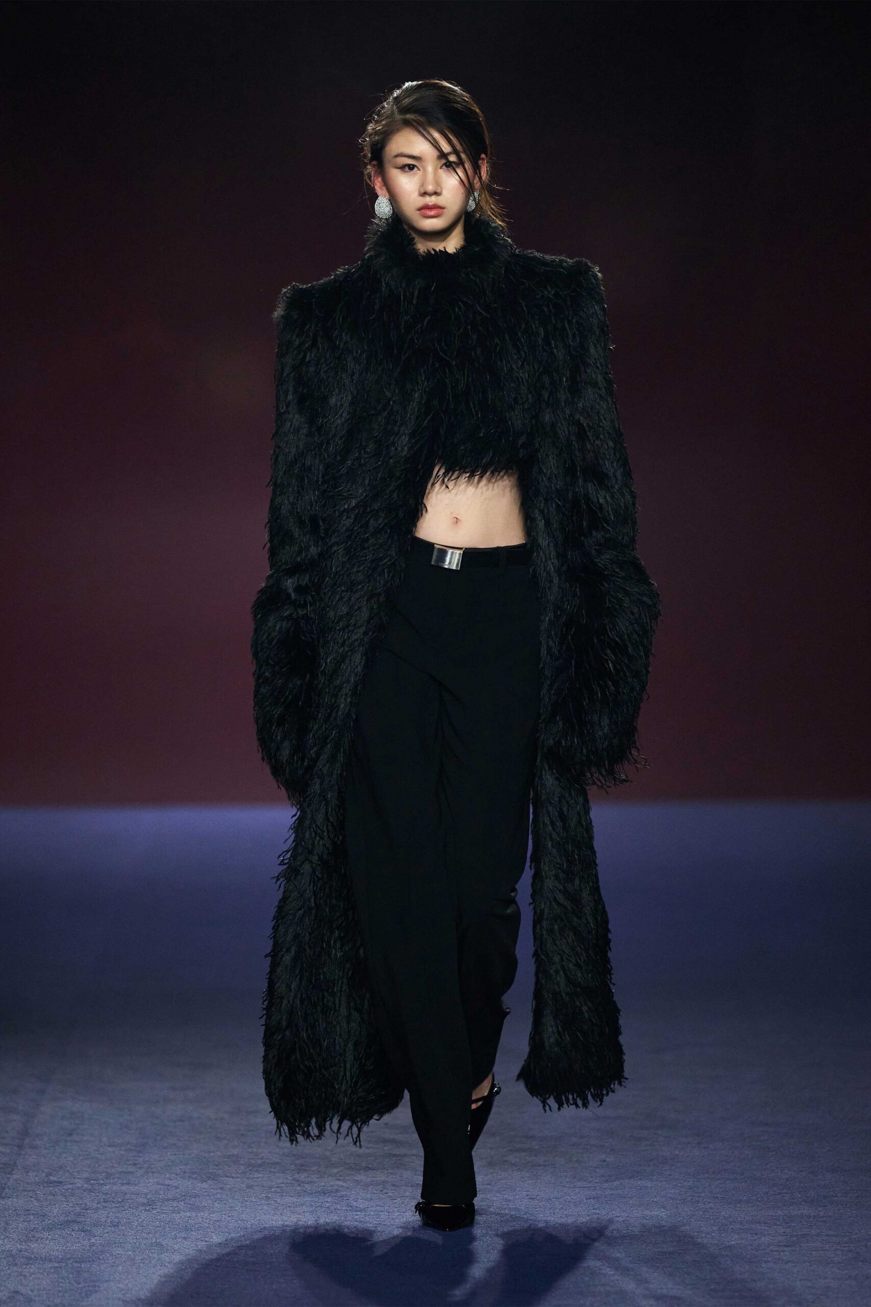 black faux-fur coat with fitted pants