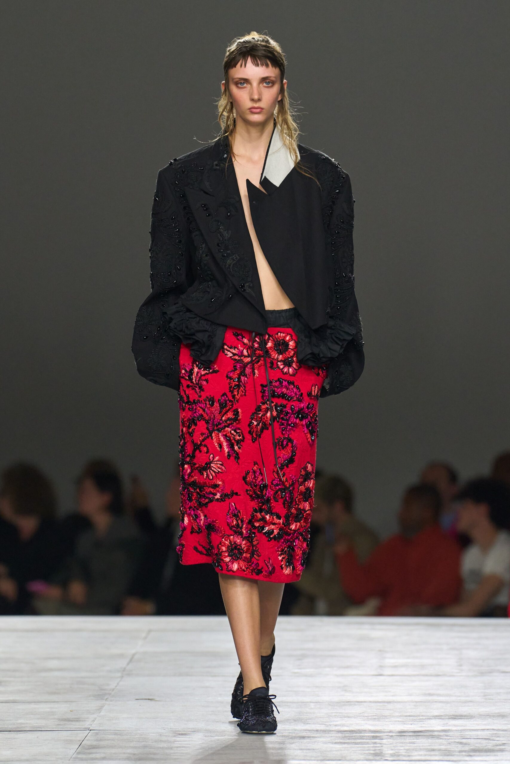 black relaxed jacket with red skirt