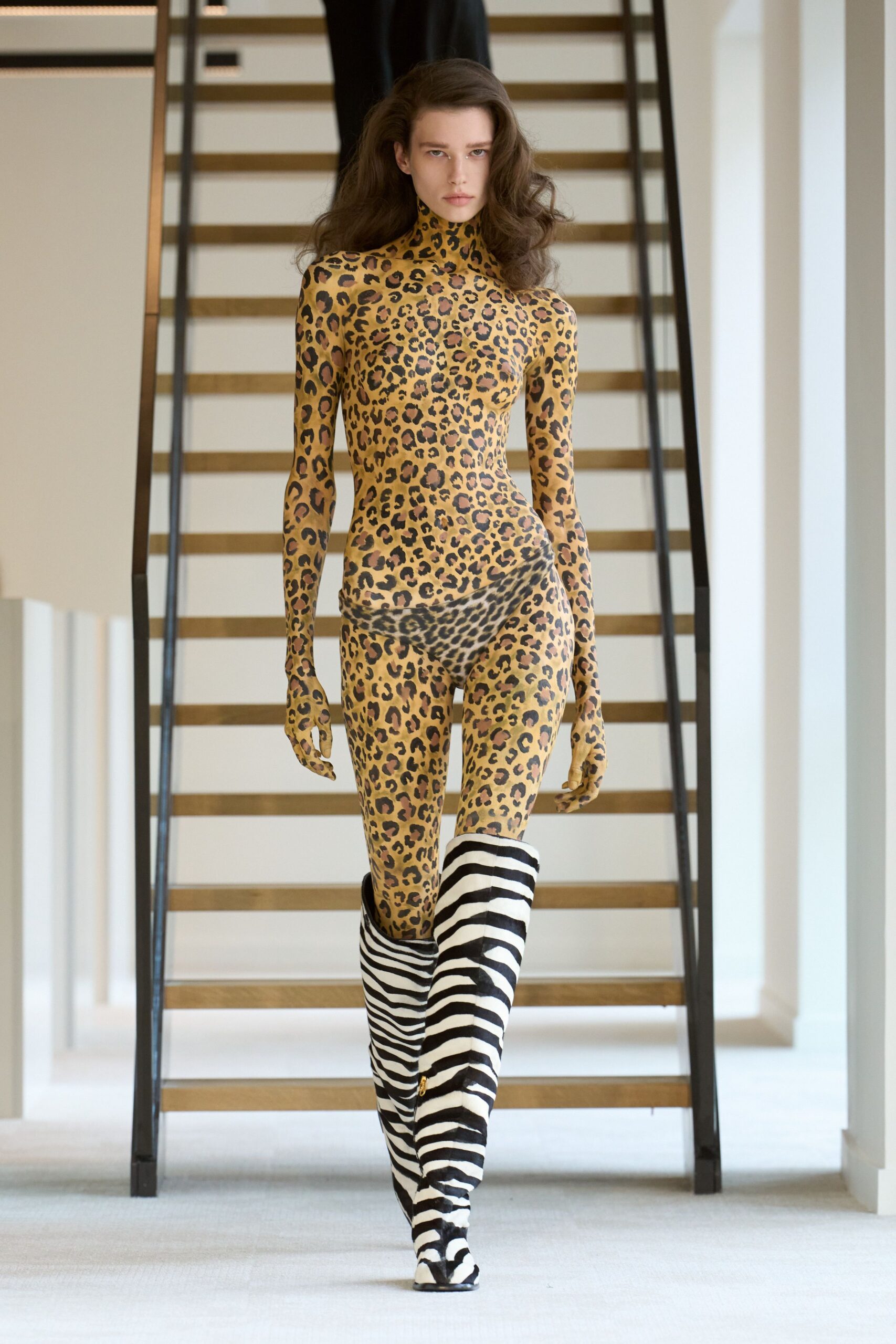 animal-print catsuit with striped boots