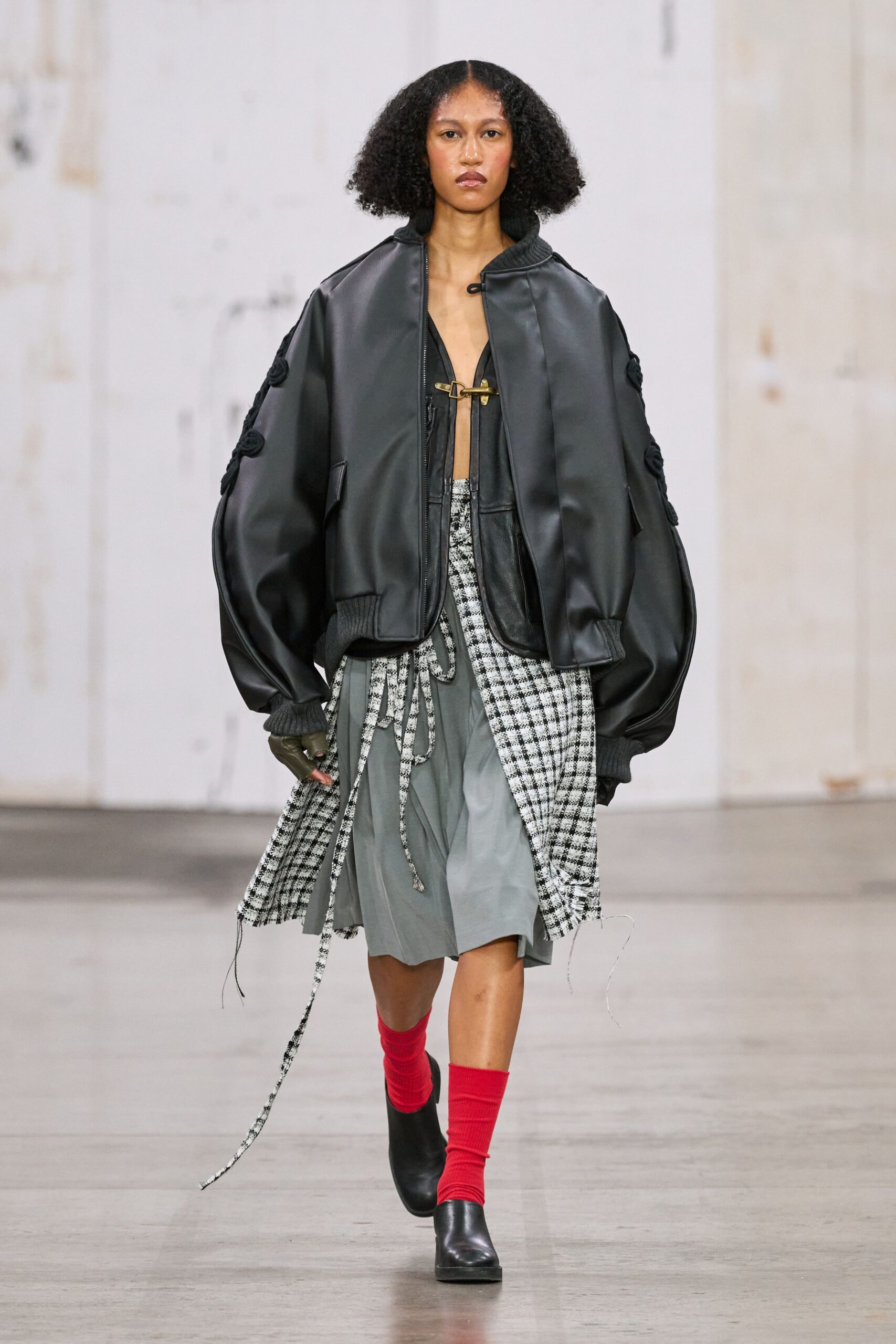 black oversized jacket with gray skirt