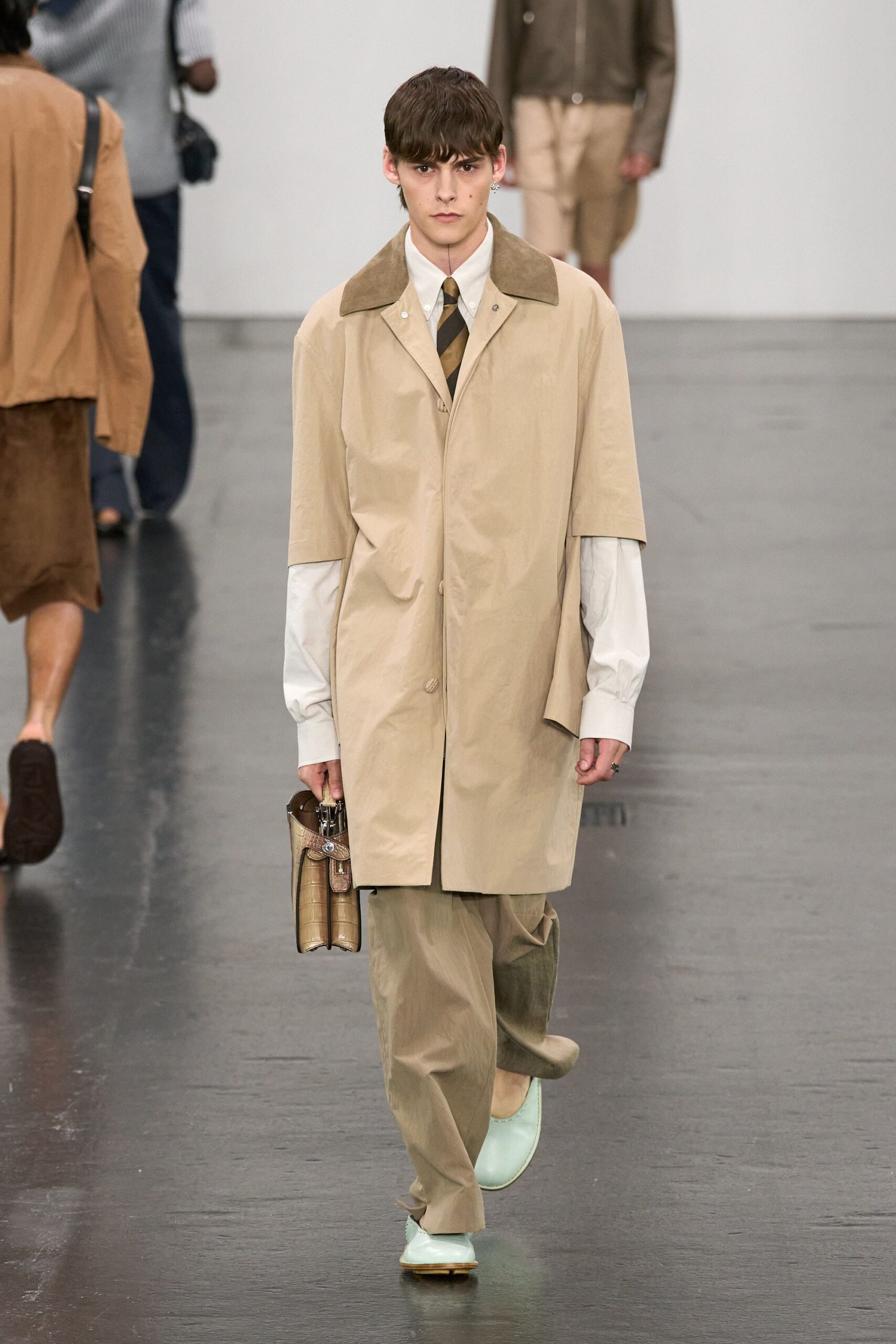 beige coat with relaxed pants