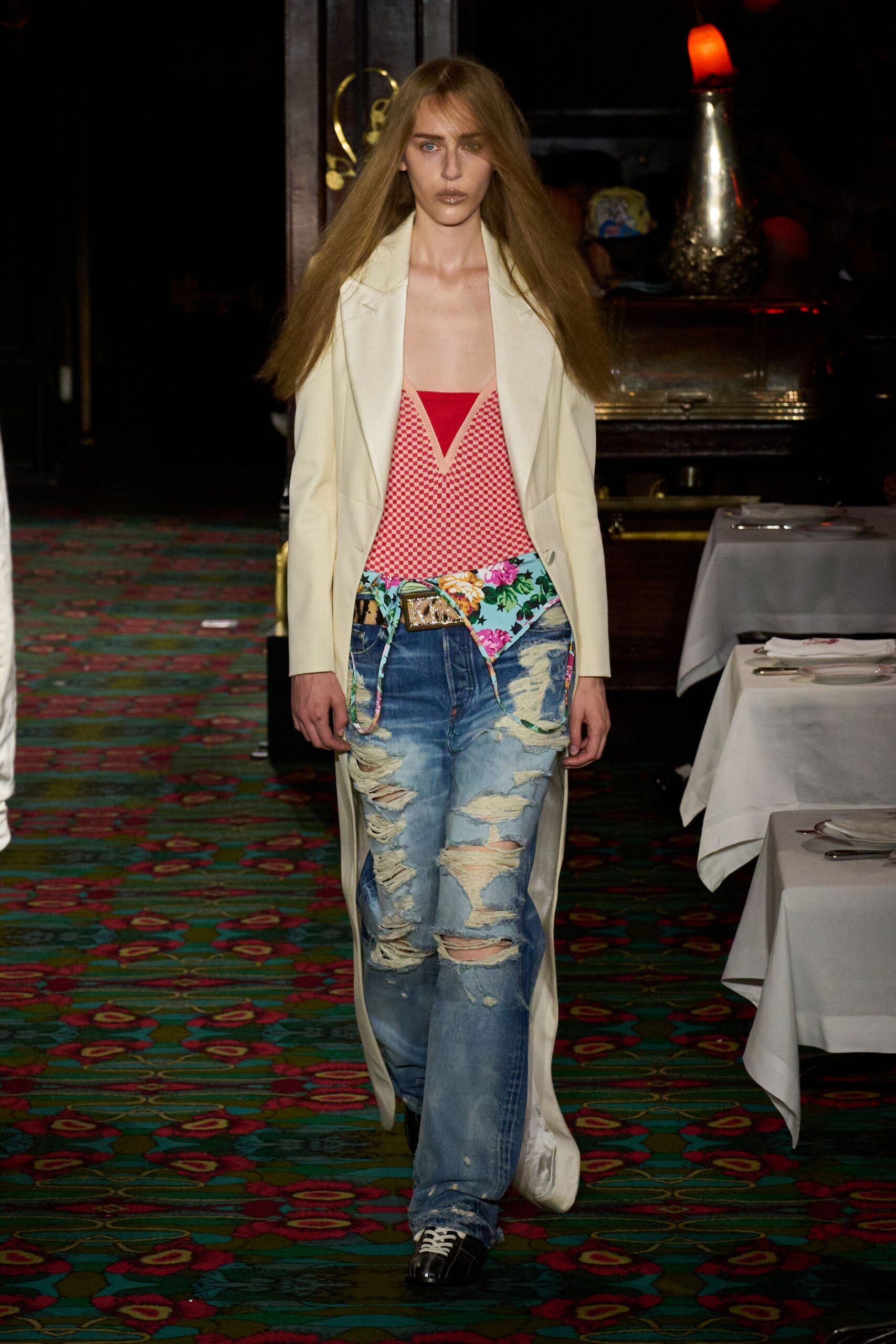 white coat red top distressed jeans