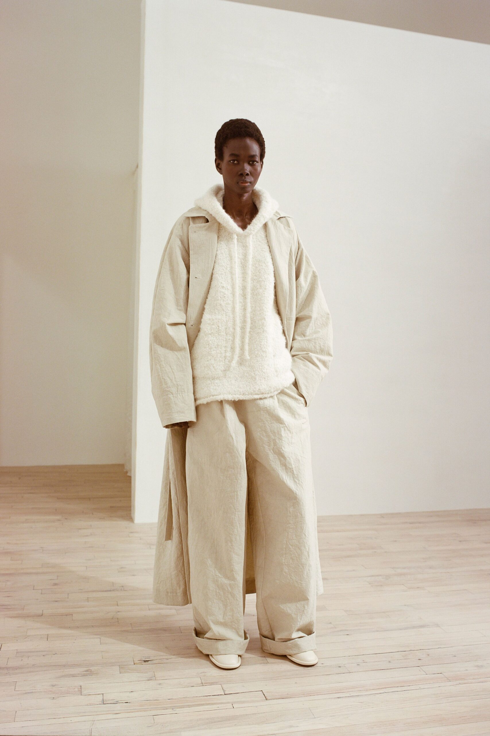 beige relaxed coat and hoodie