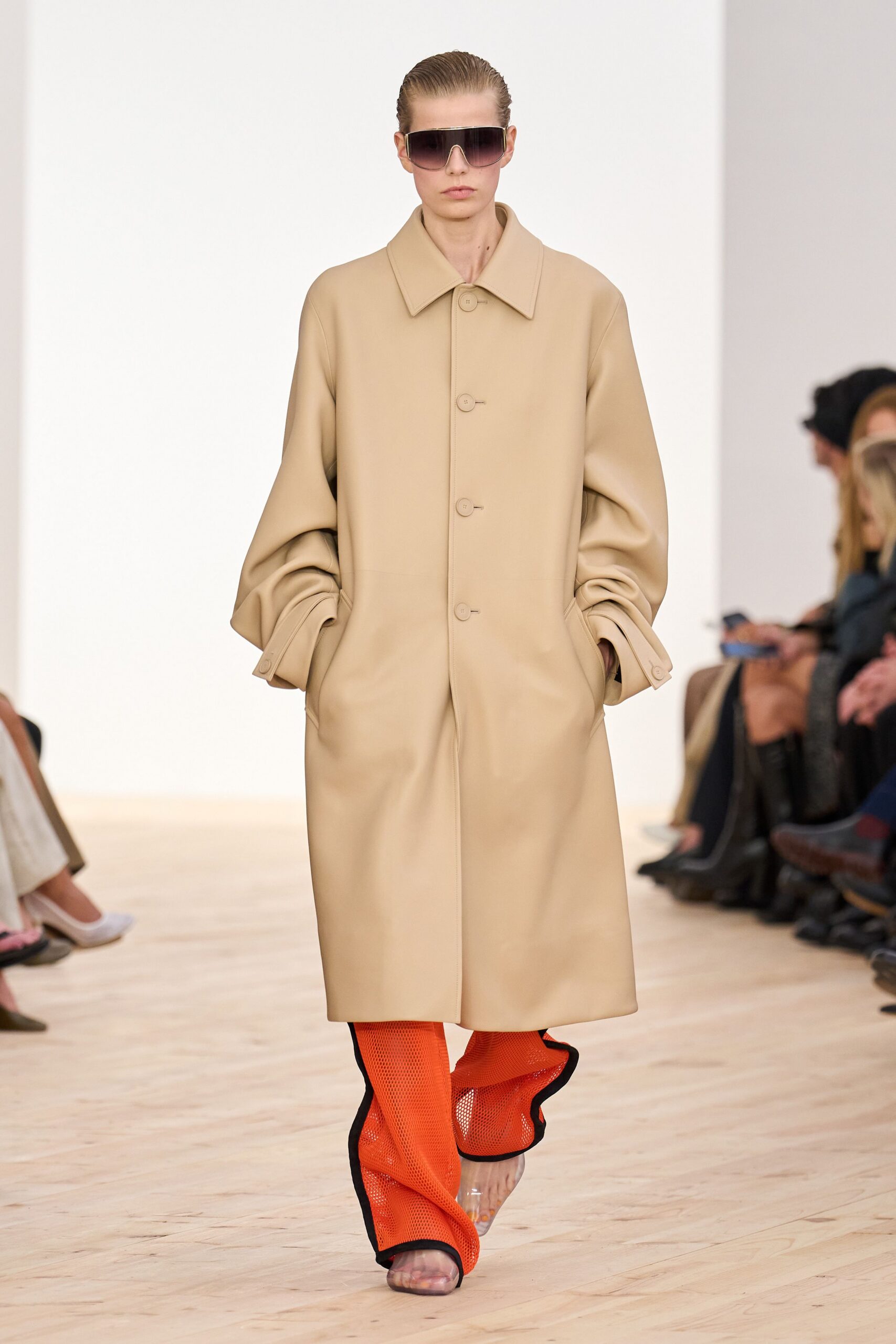 beige vinyl long-sleeve collared oversized buttoned coat