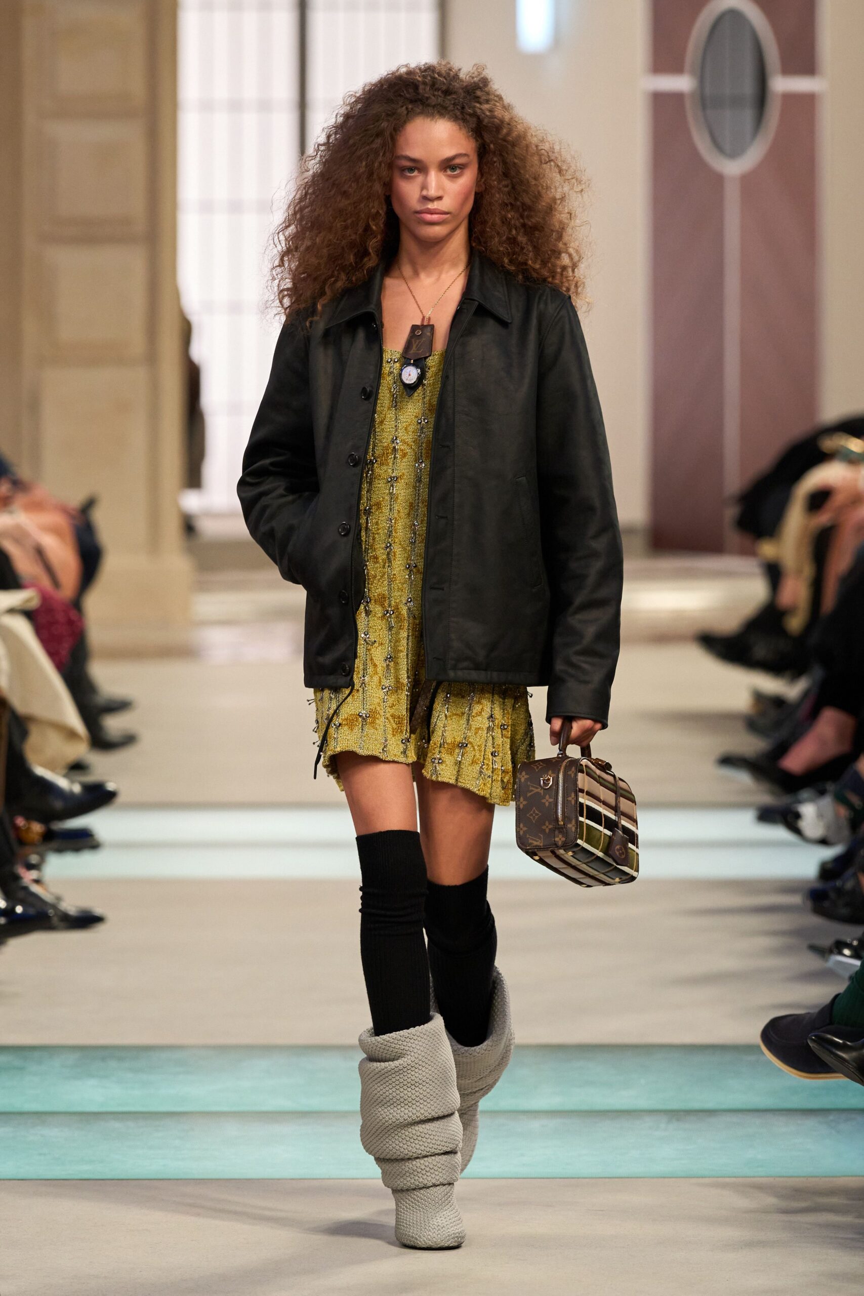 yellow pleated mini dress with black jacket