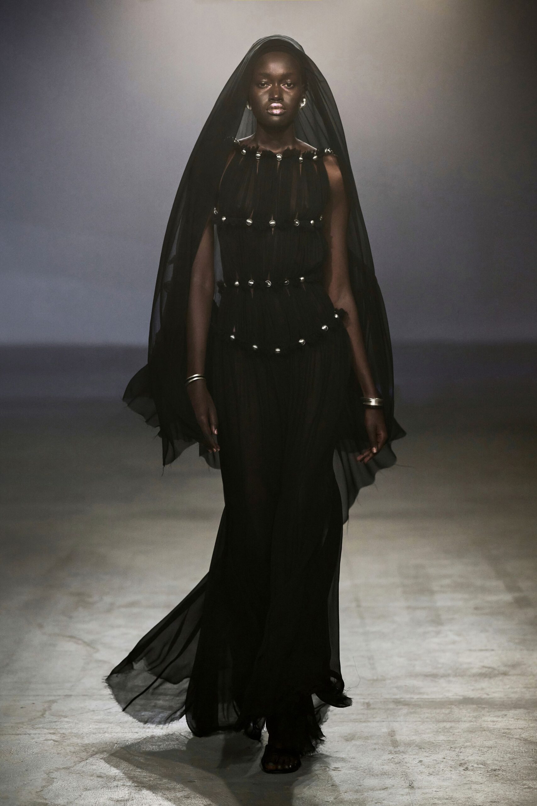 black chiffon sleeveless high-neck fitted layered pleated gown