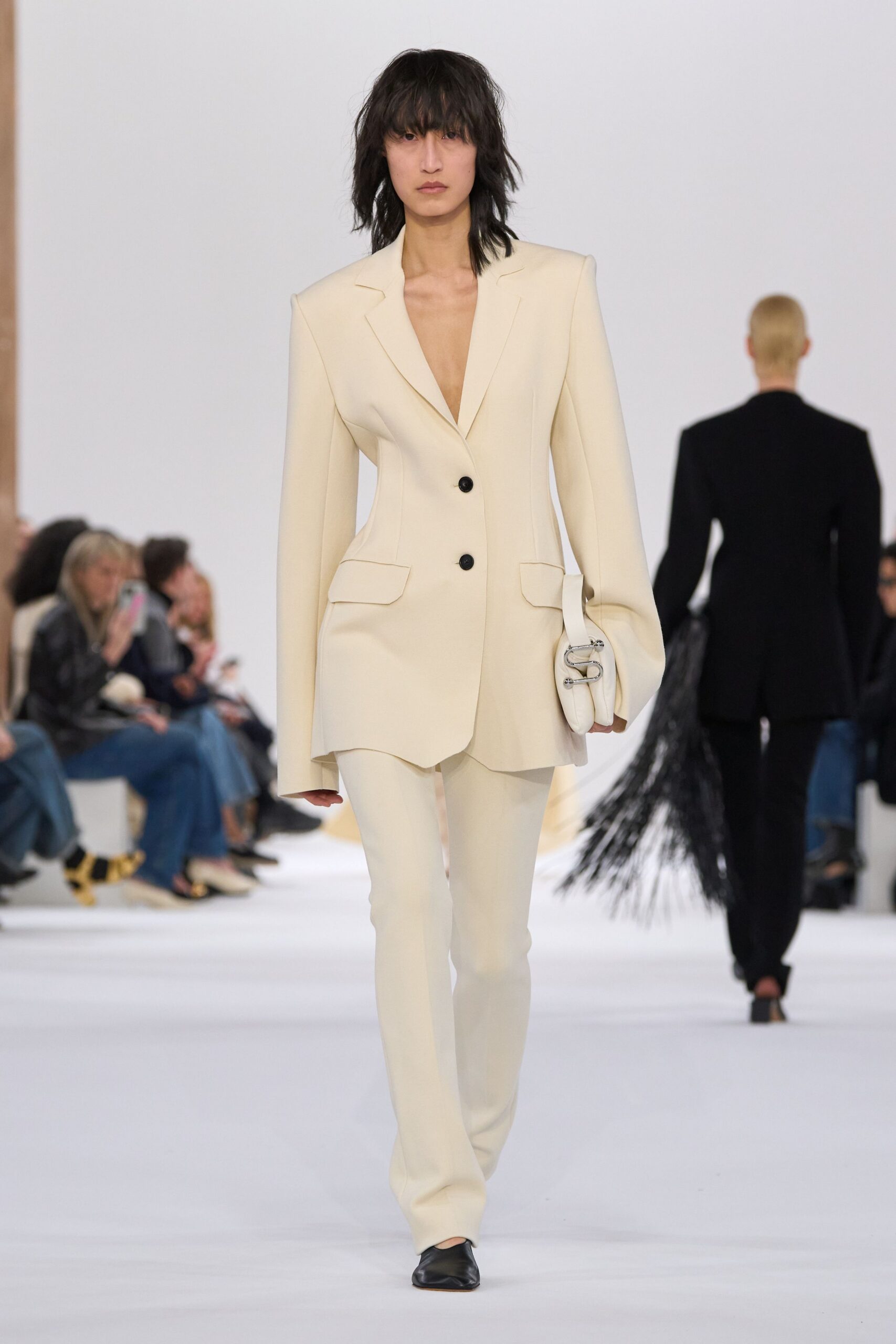 white tailored suit with black shoes