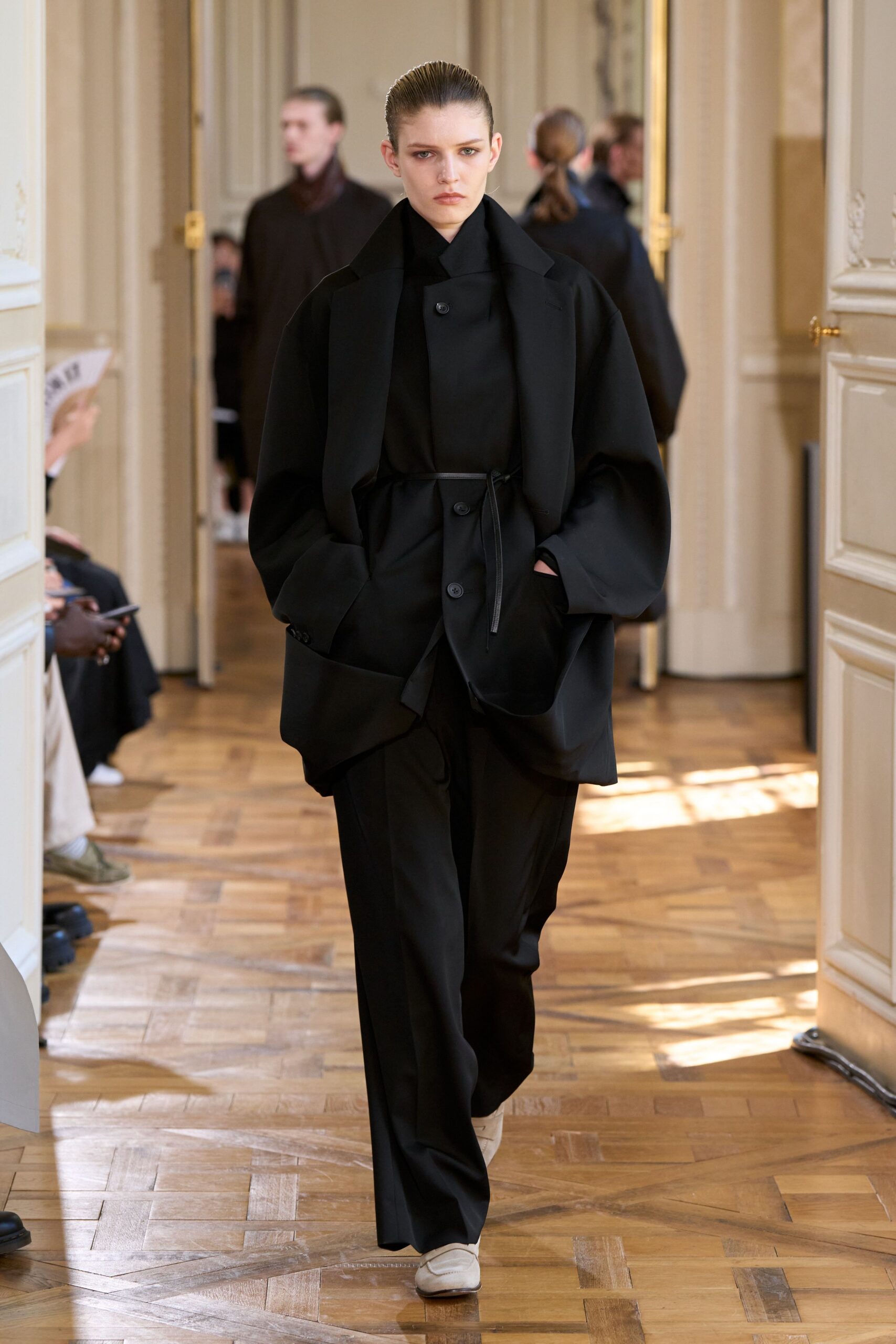 black oversized coat and relaxed pants
