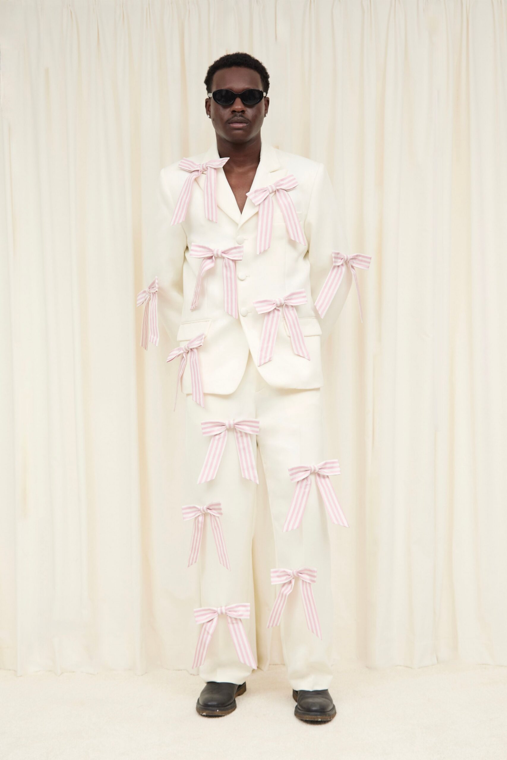 white tailored suit with bows