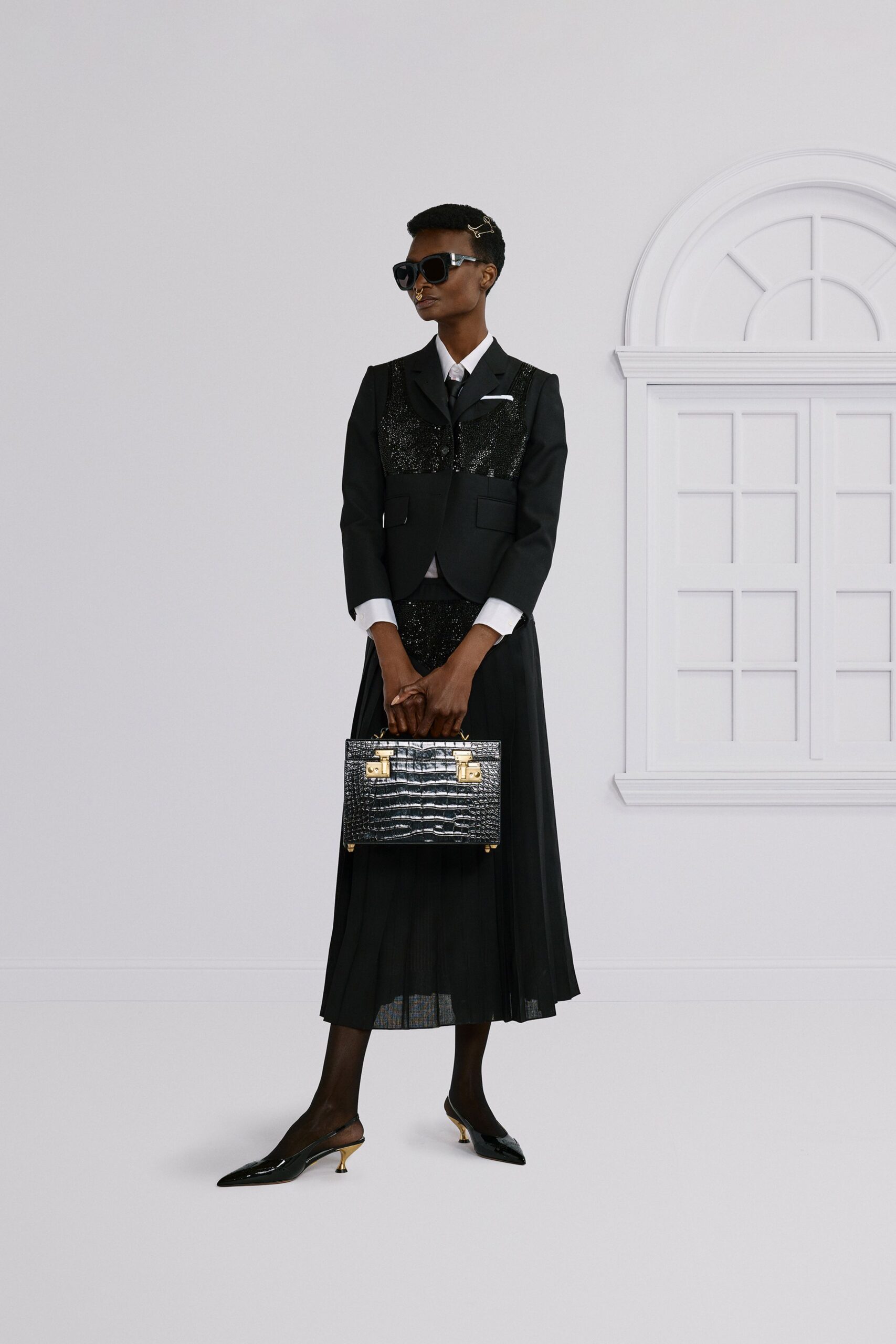 black sequined blazer with pleated skirt