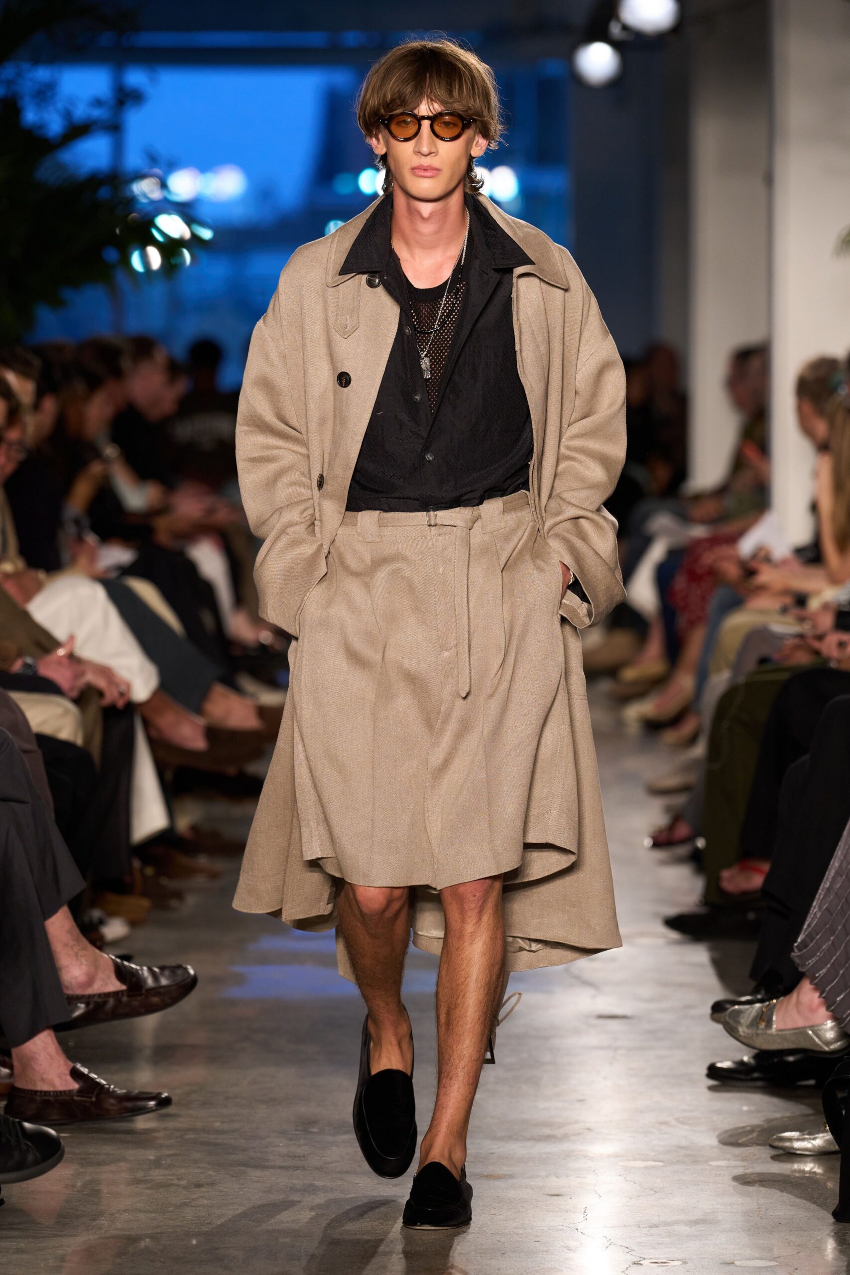 beige coat black shirt pleated skirt