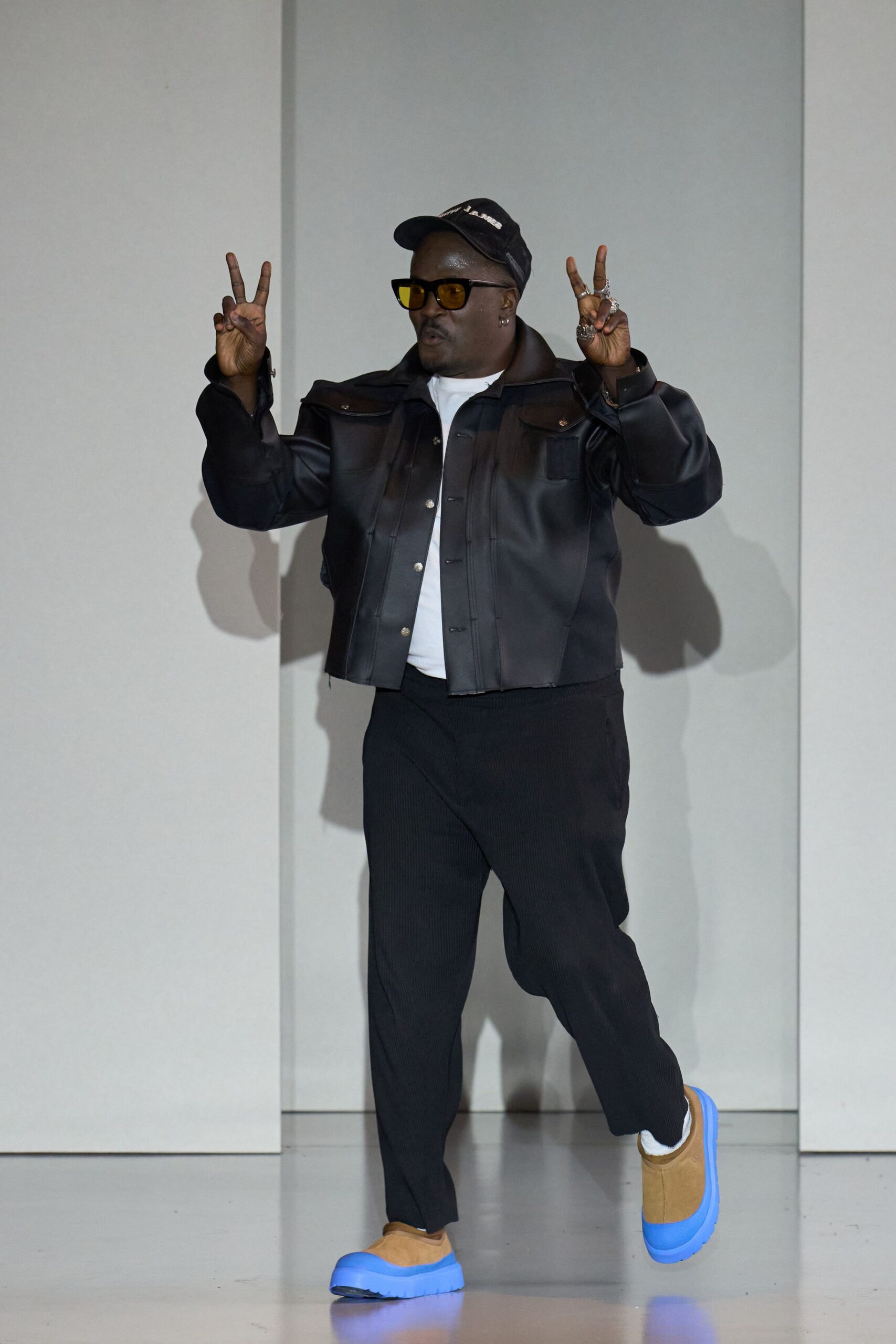 black leather jacket with blue shoes