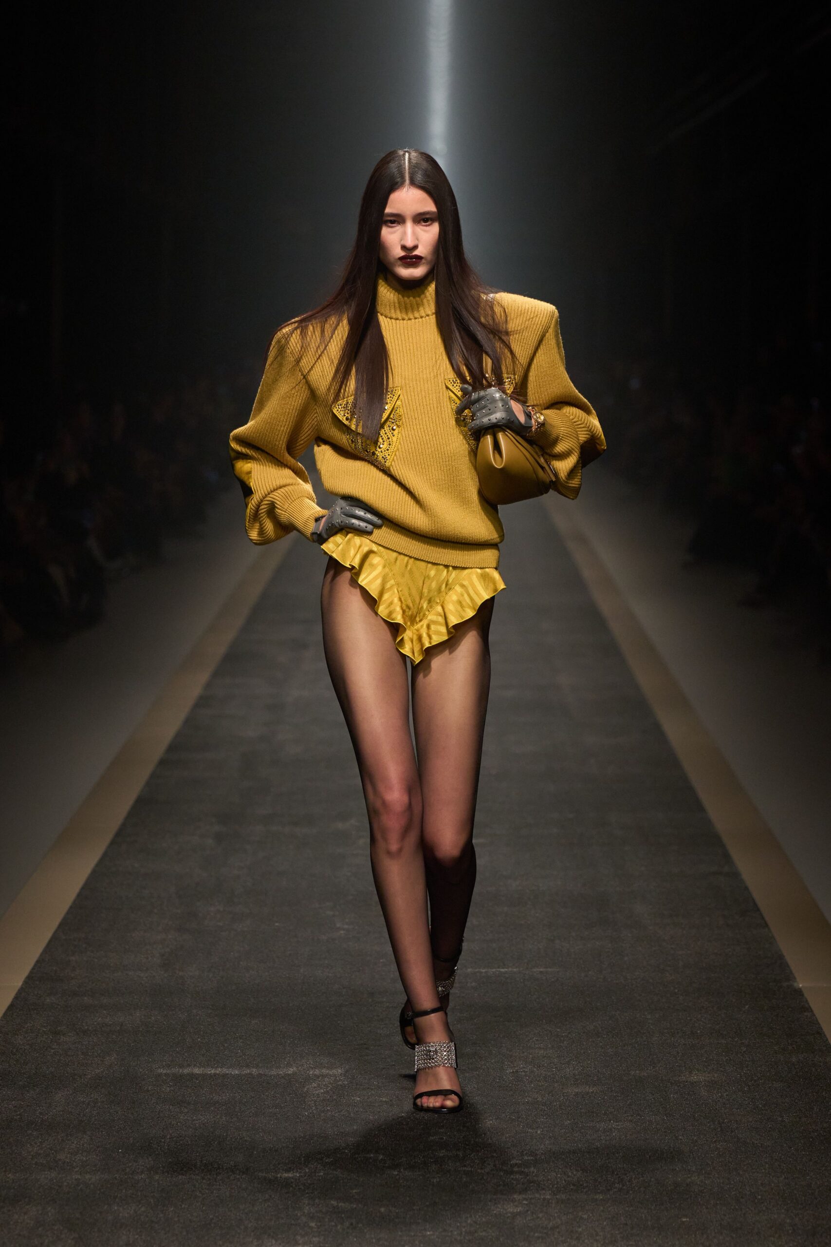 oversized yellow knit top with ruffled shorts