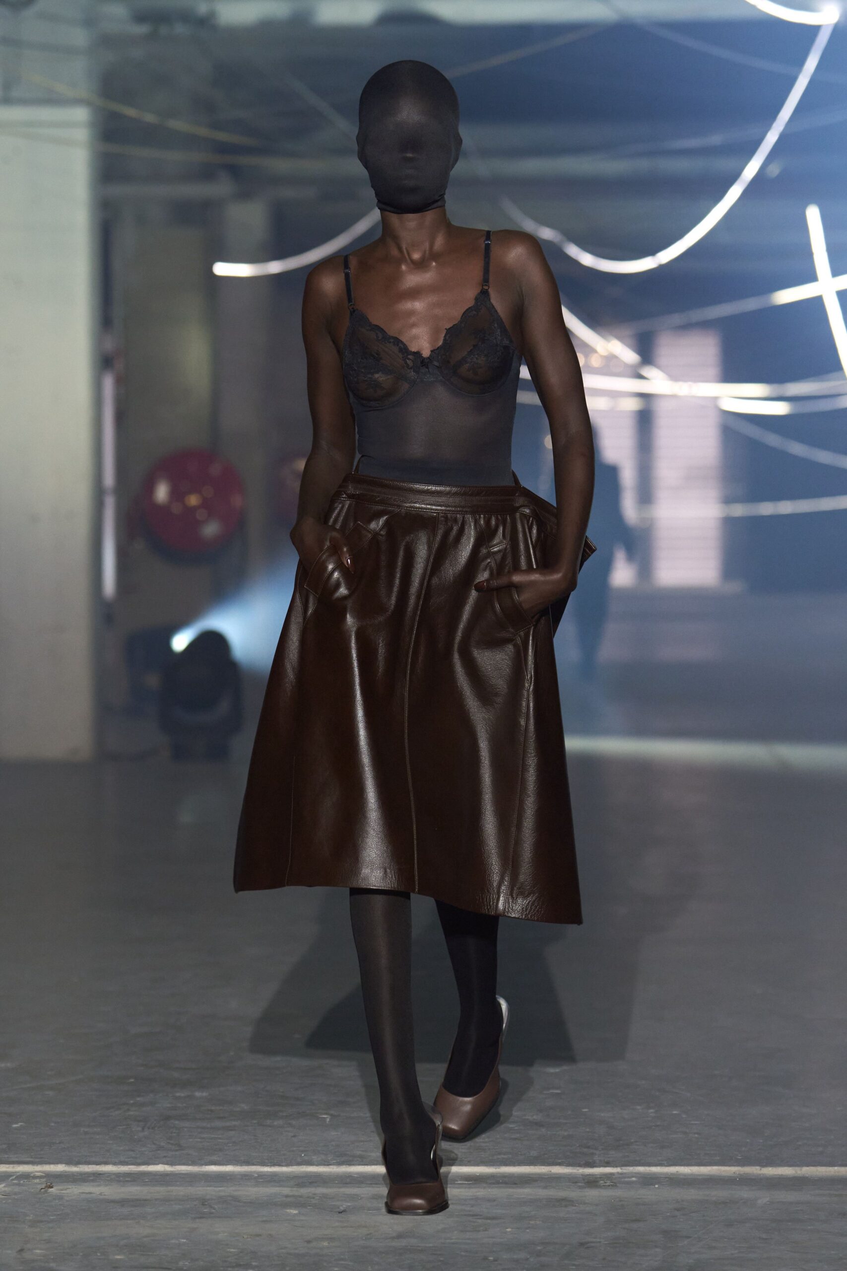 black sheer top brown leather skirt