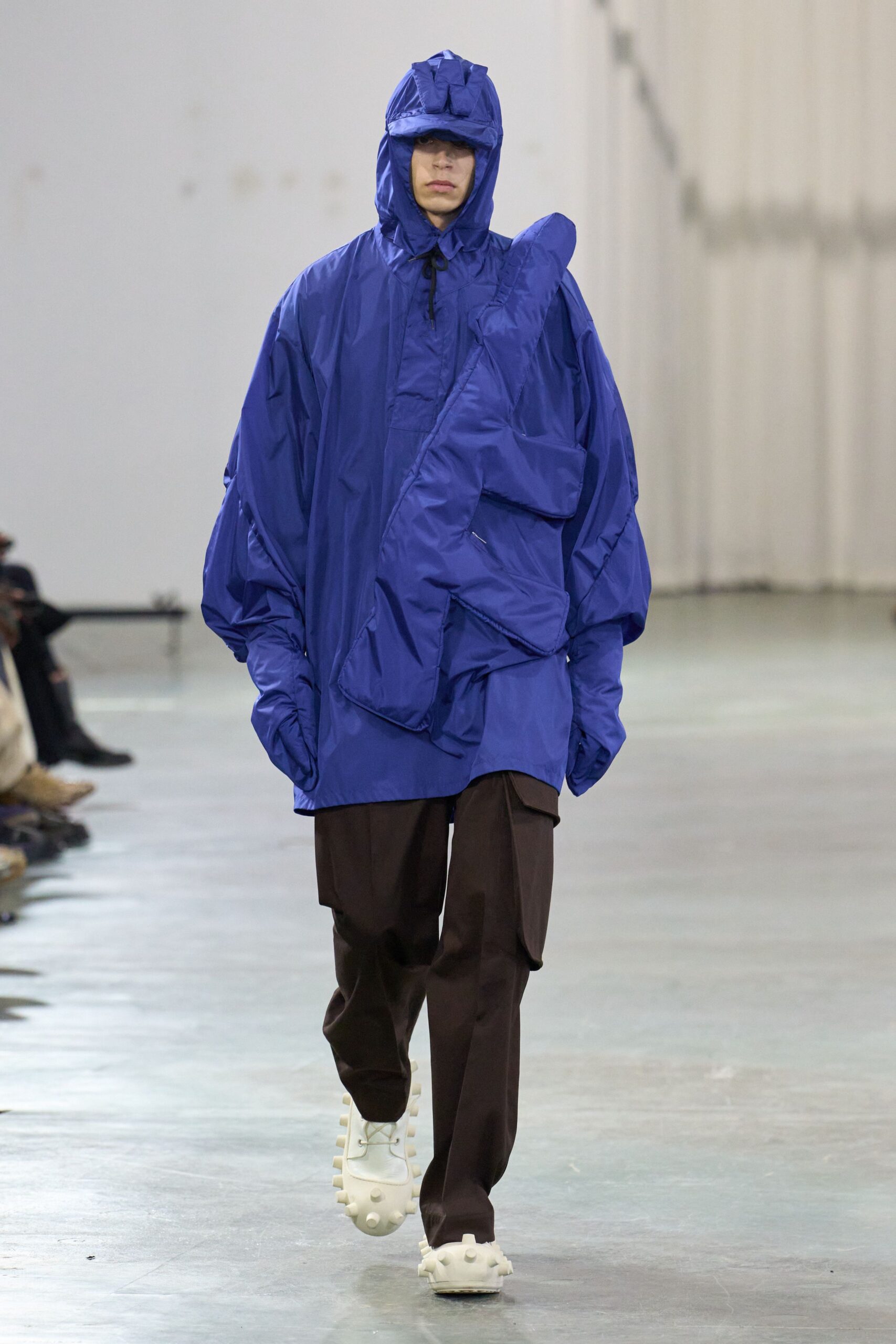 blue oversized jacket with brown pants
