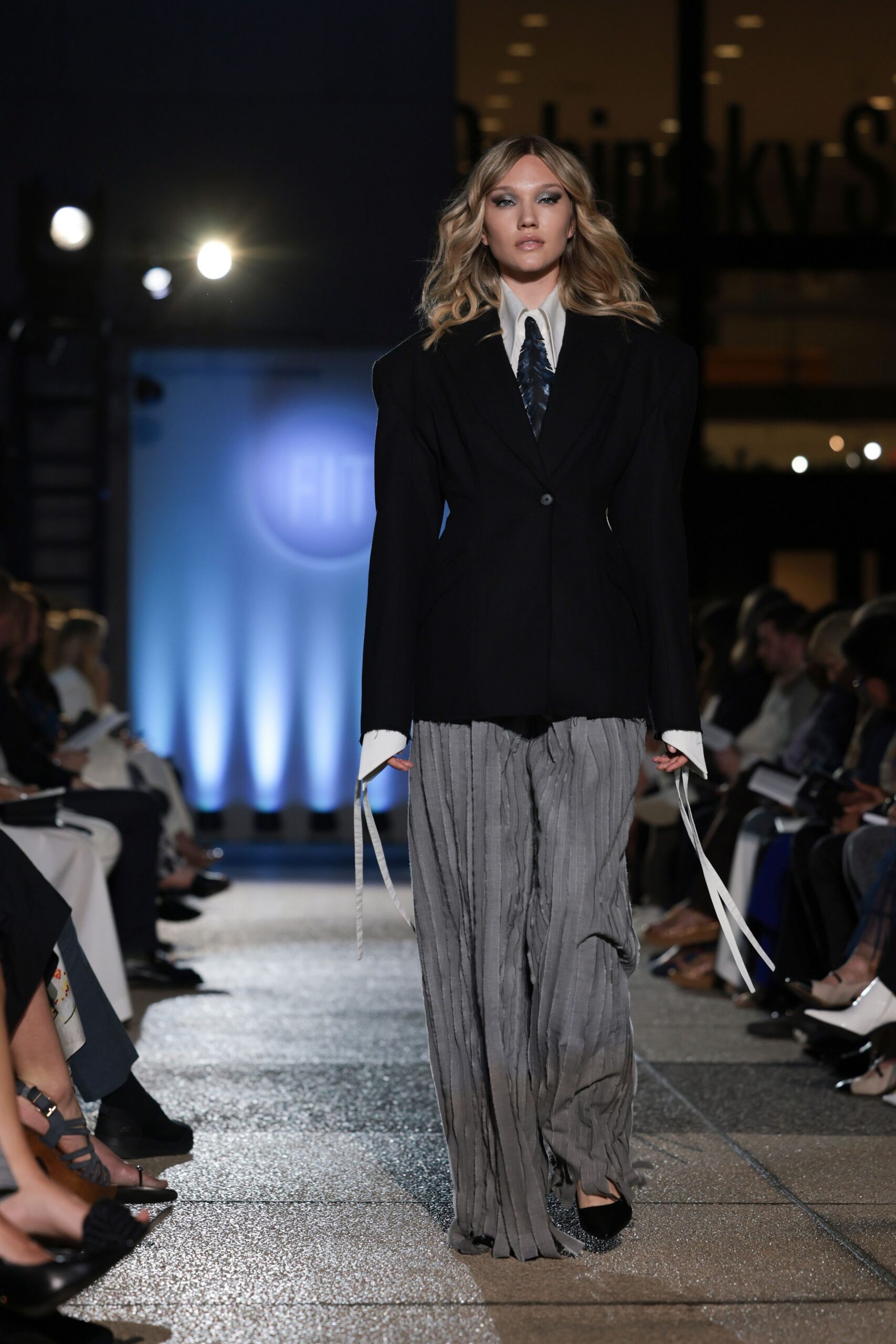 black blazer gray pleated pants