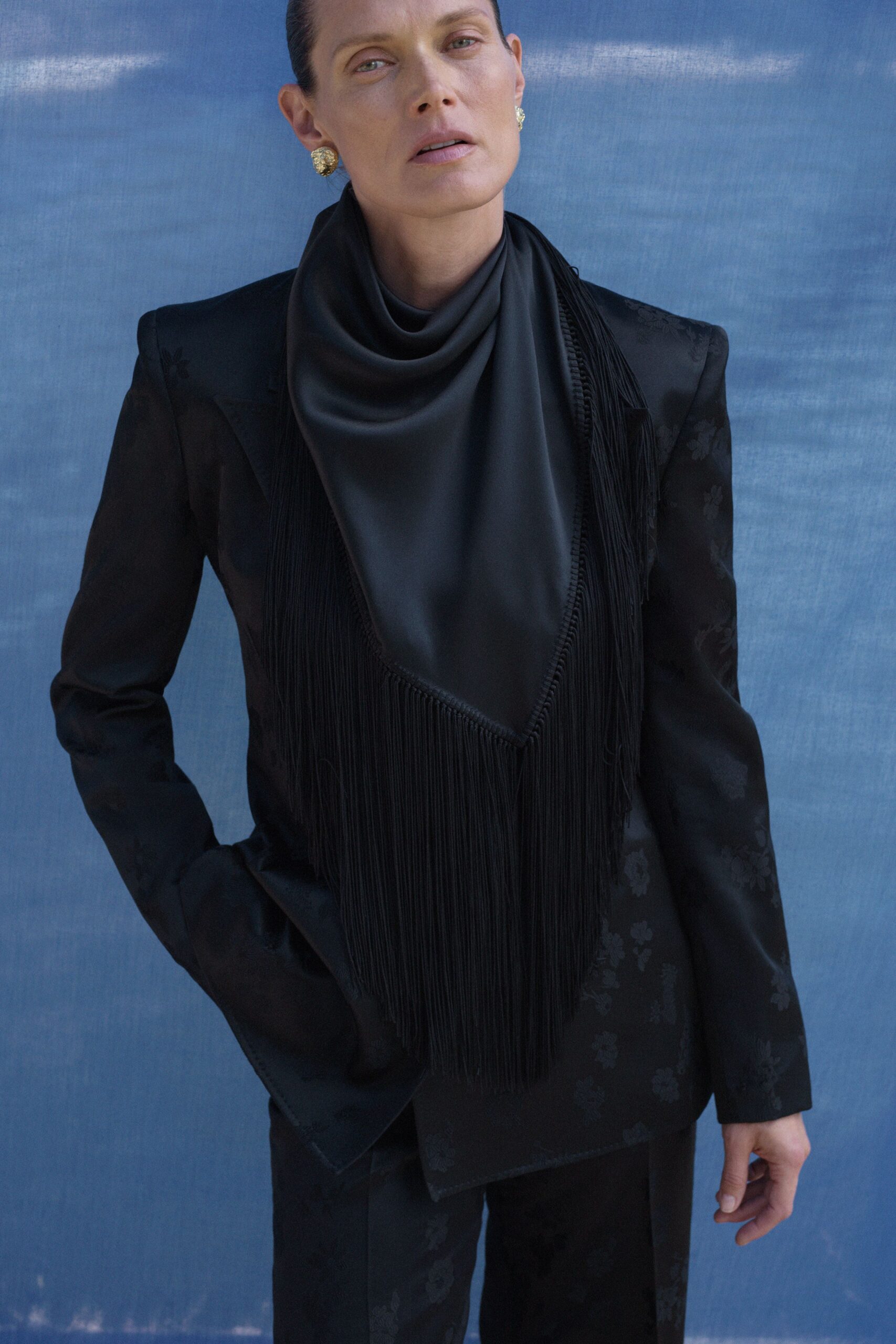 black tailored blazer with fringed scarf