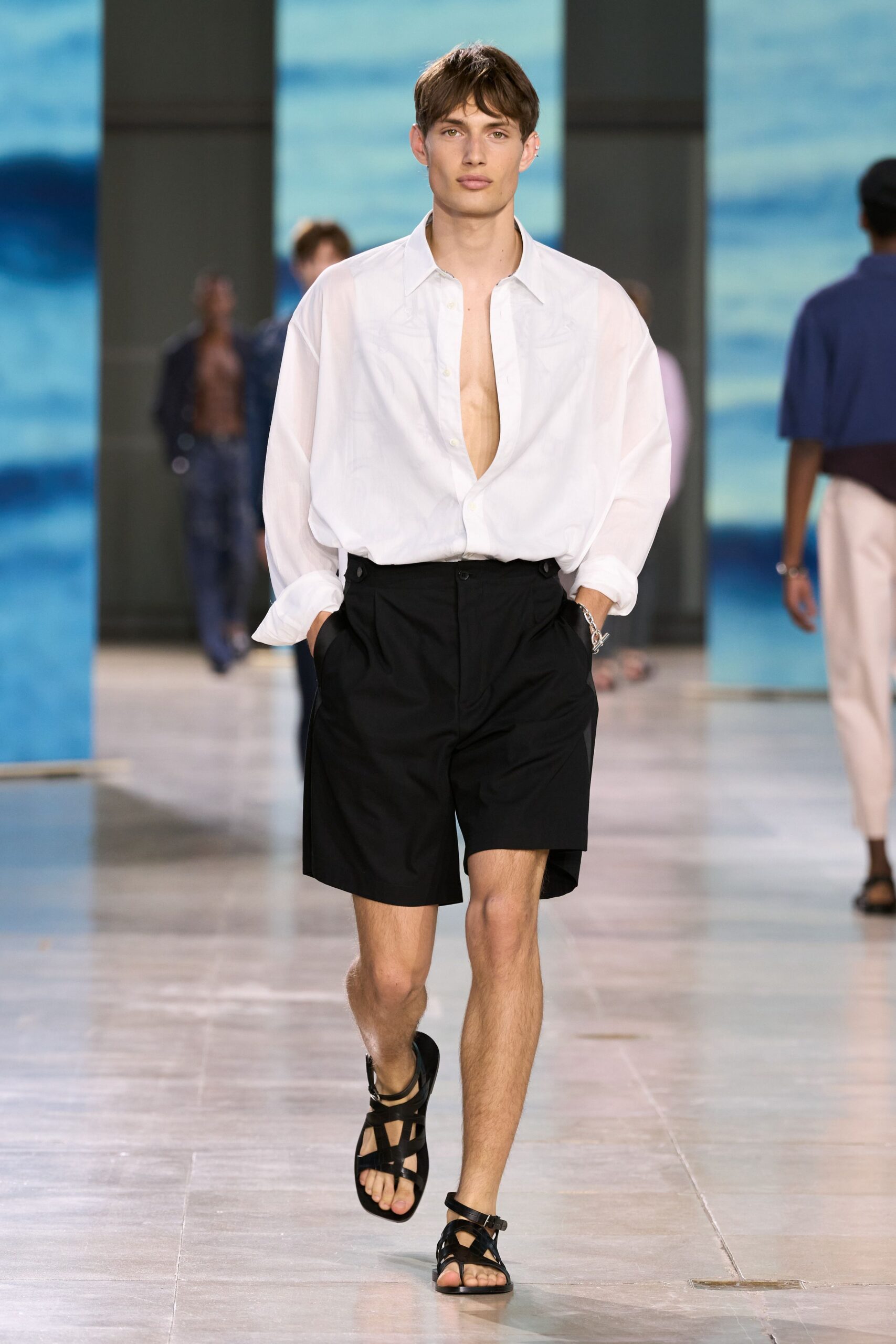 white relaxed shirt black shorts sandals
