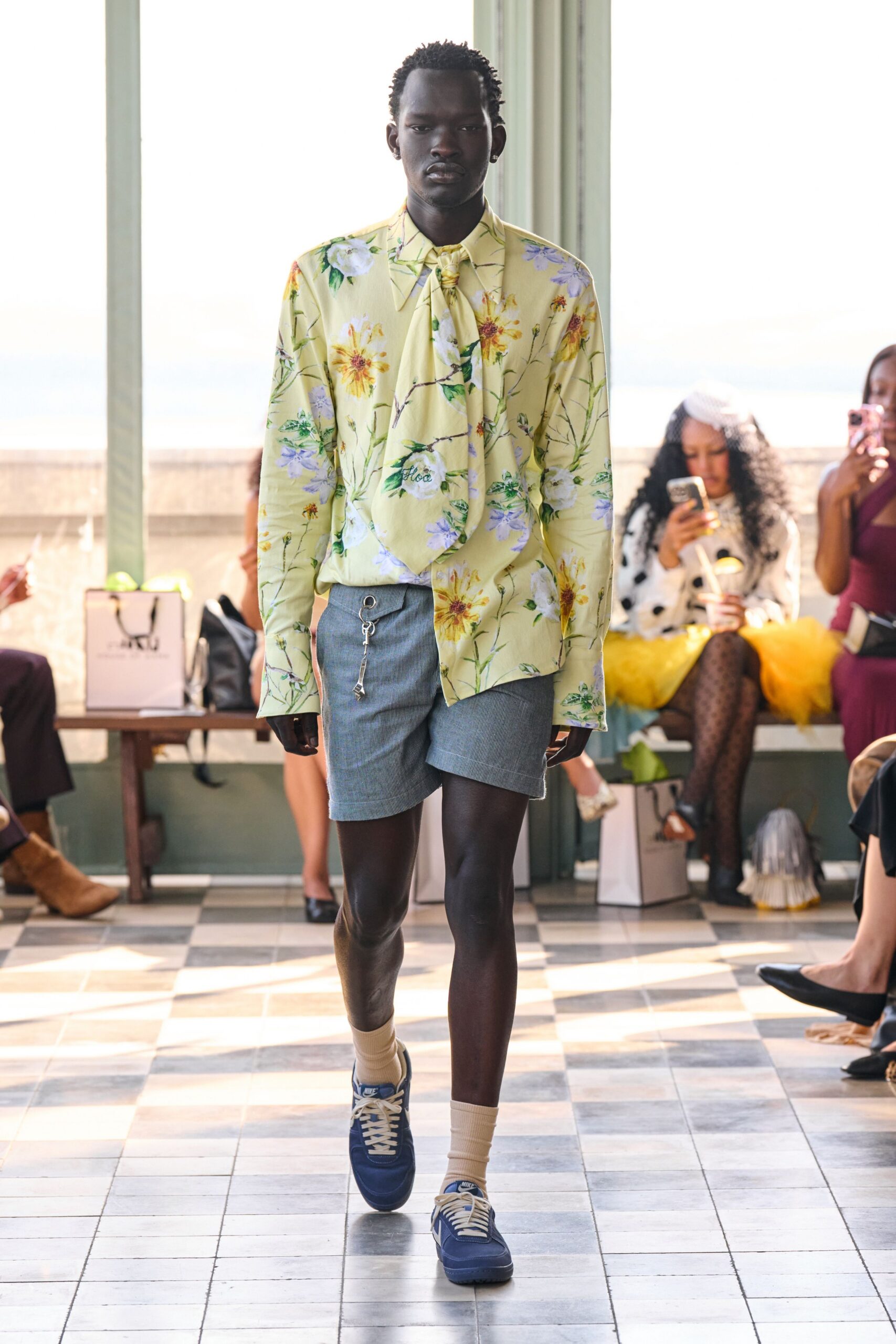 yellow floral shirt with blue shorts
