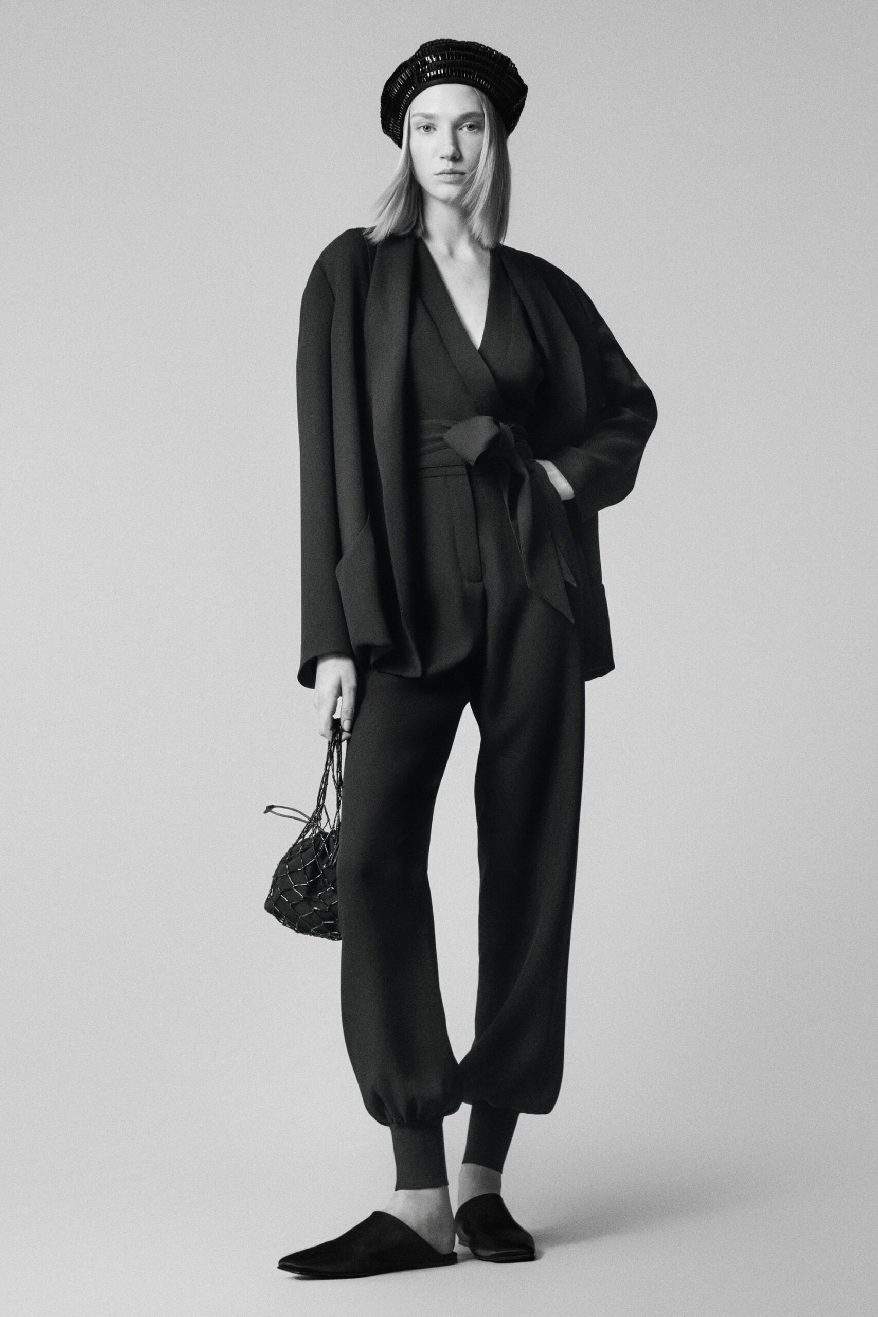 black wool v-neck long-sleeve fitted zippered jumpsuit