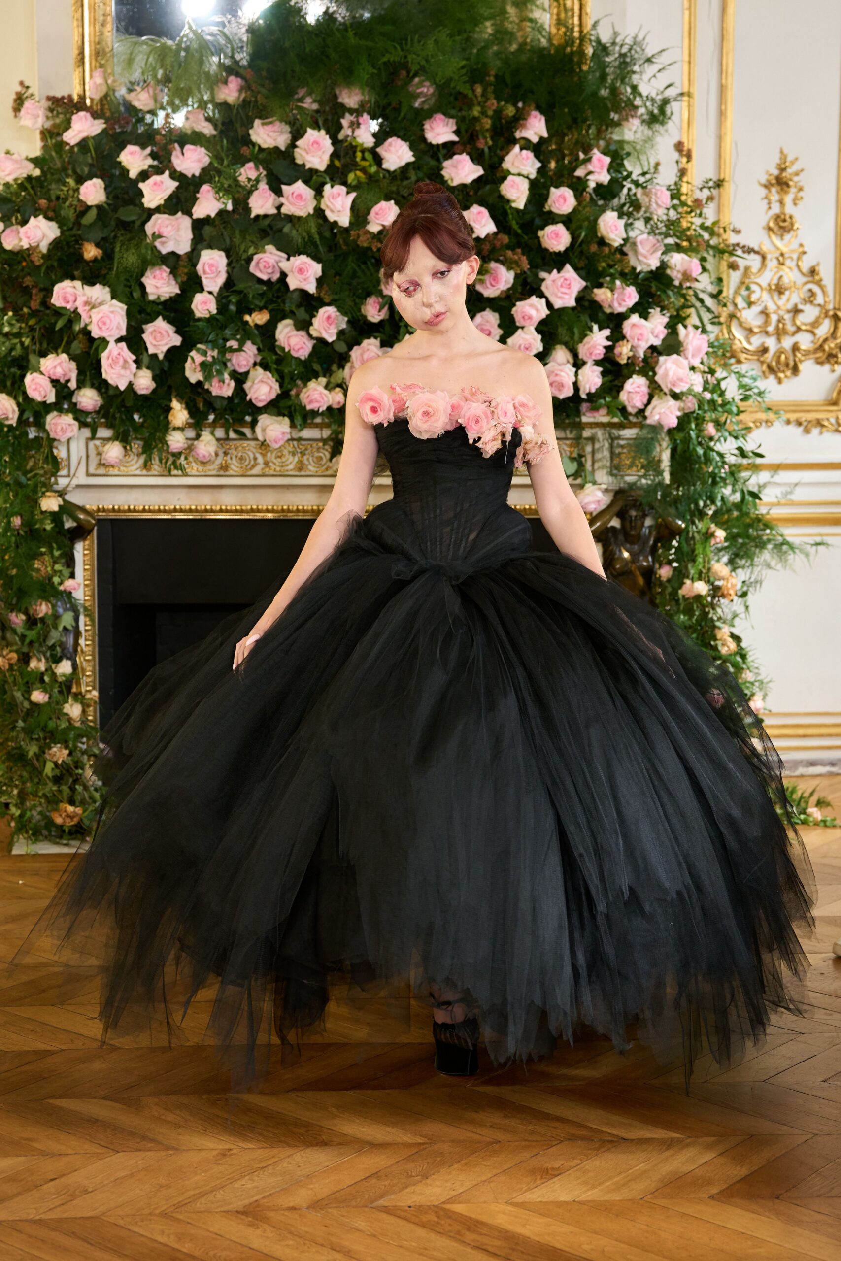 black tulle strapless fitted tiered ruffled flowing gown